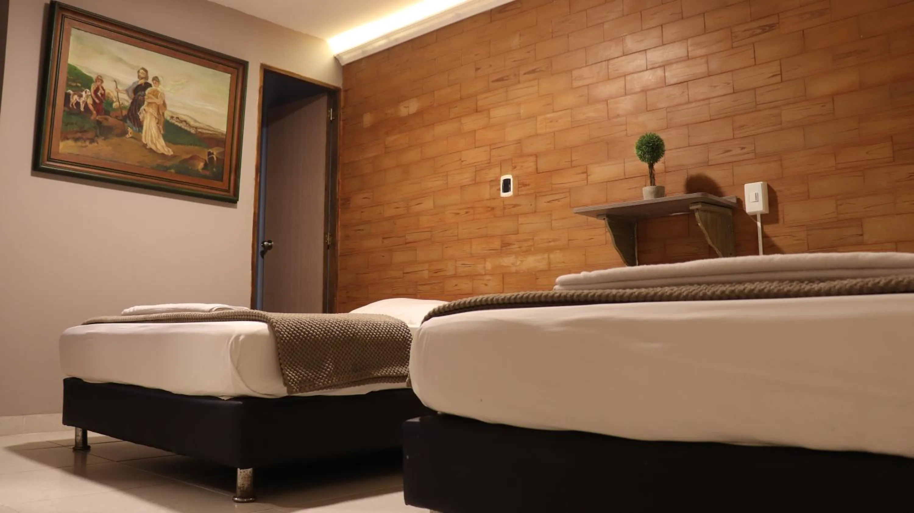 Bed in Hotel Simón Plaza