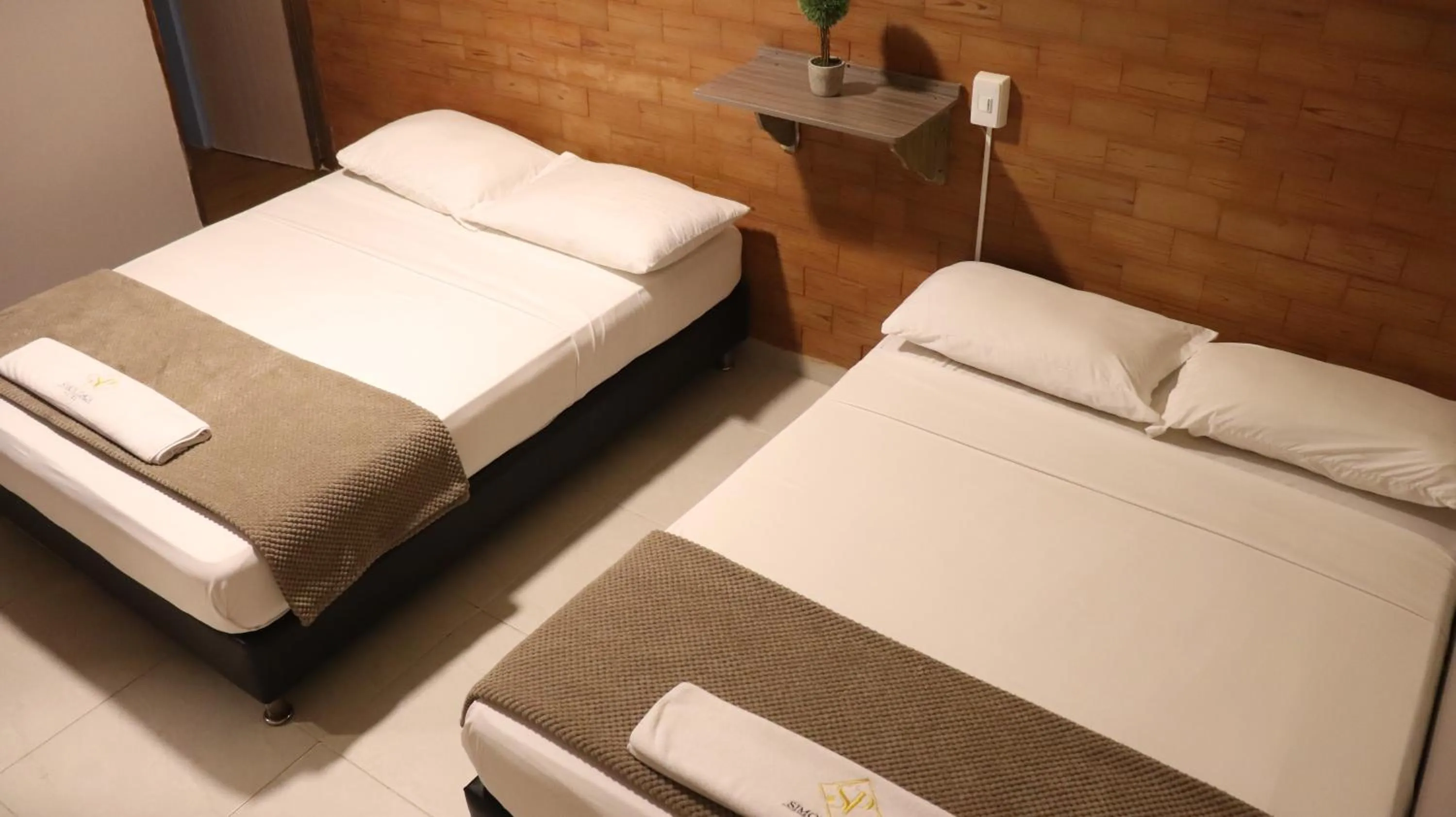 Bed in Hotel Simón Plaza