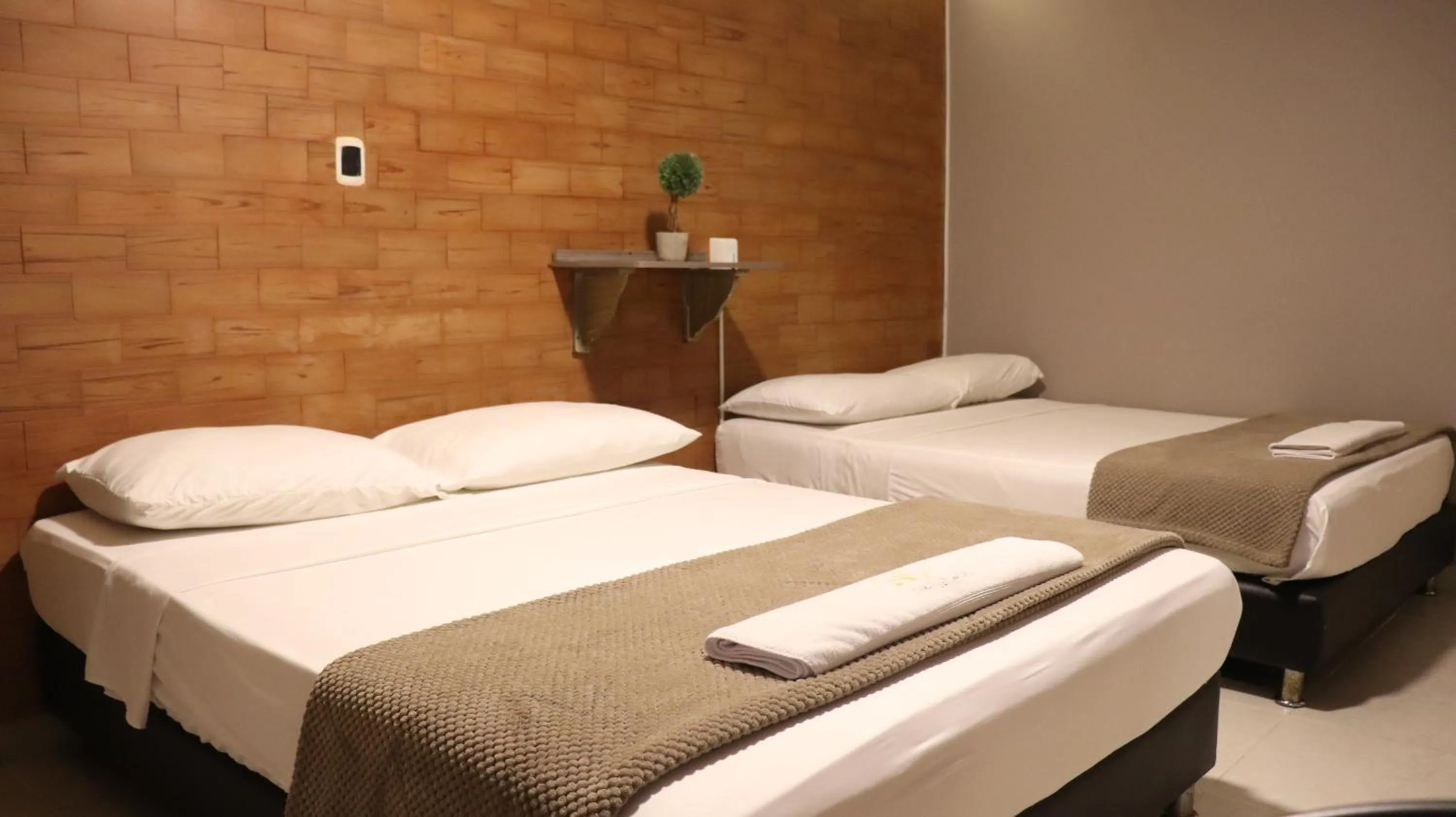 Bed in Hotel Simón Plaza