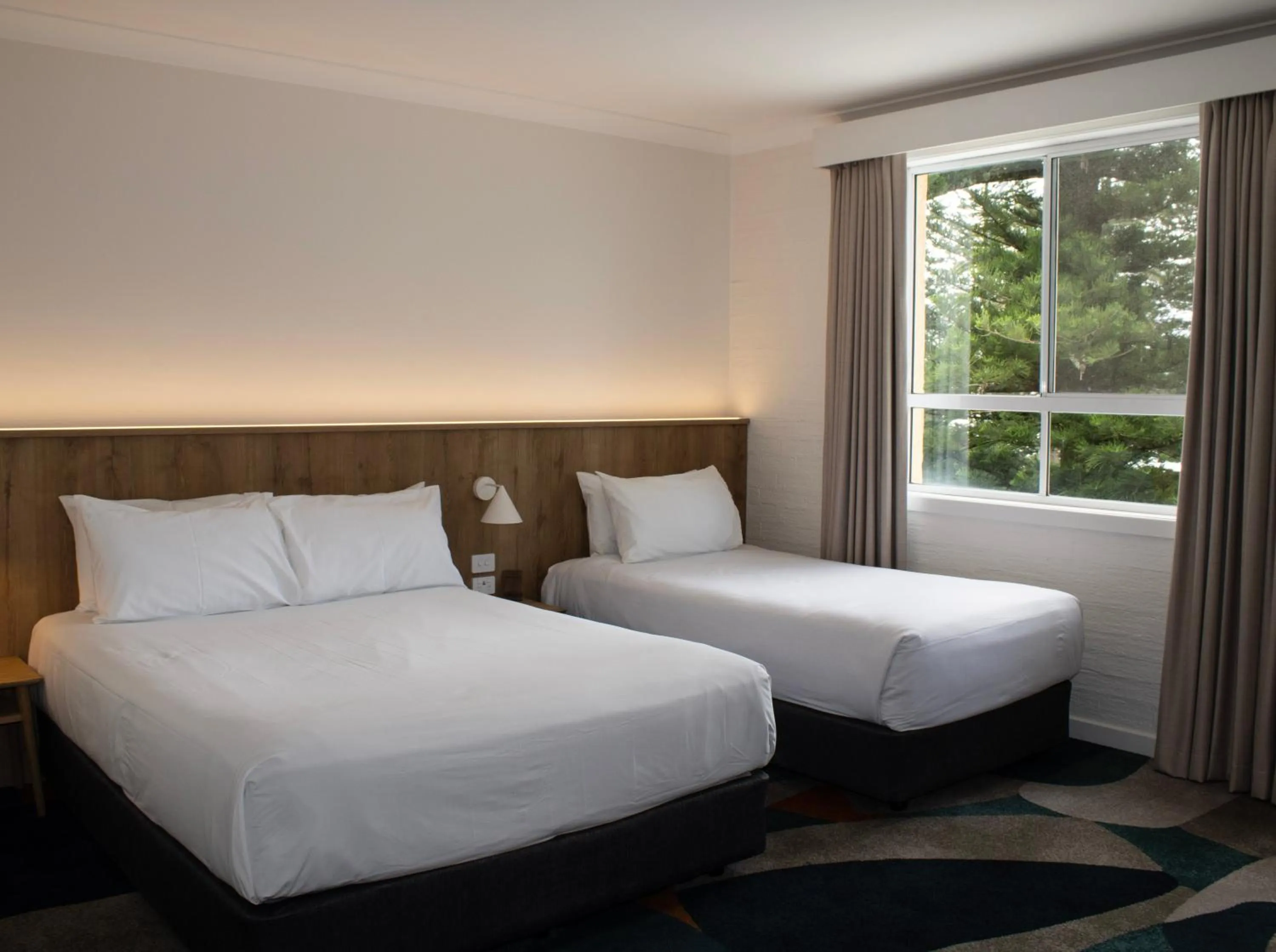 Bed in Seabreeze Beach Hotel