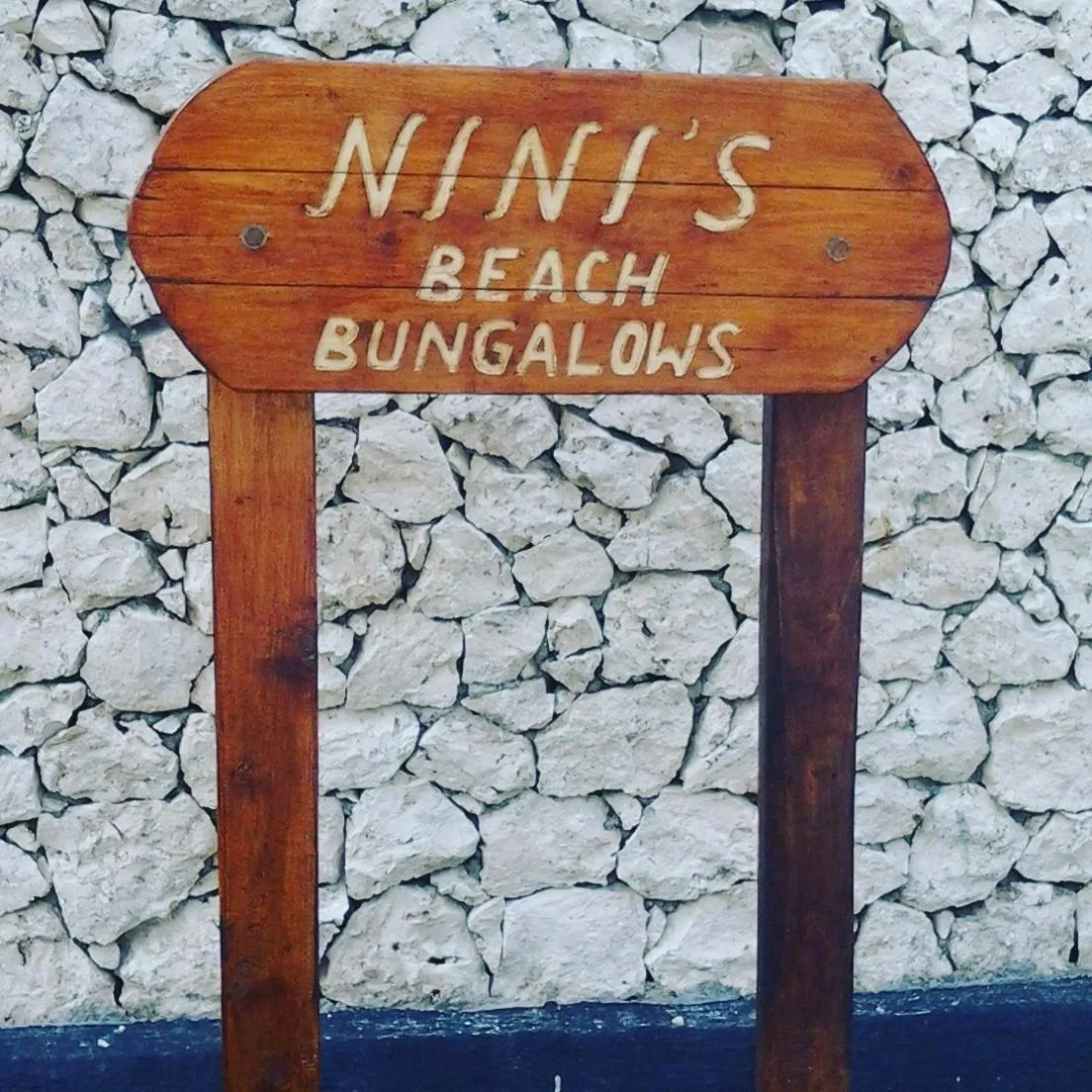 Property logo or sign in Nini's Beach Bungalows