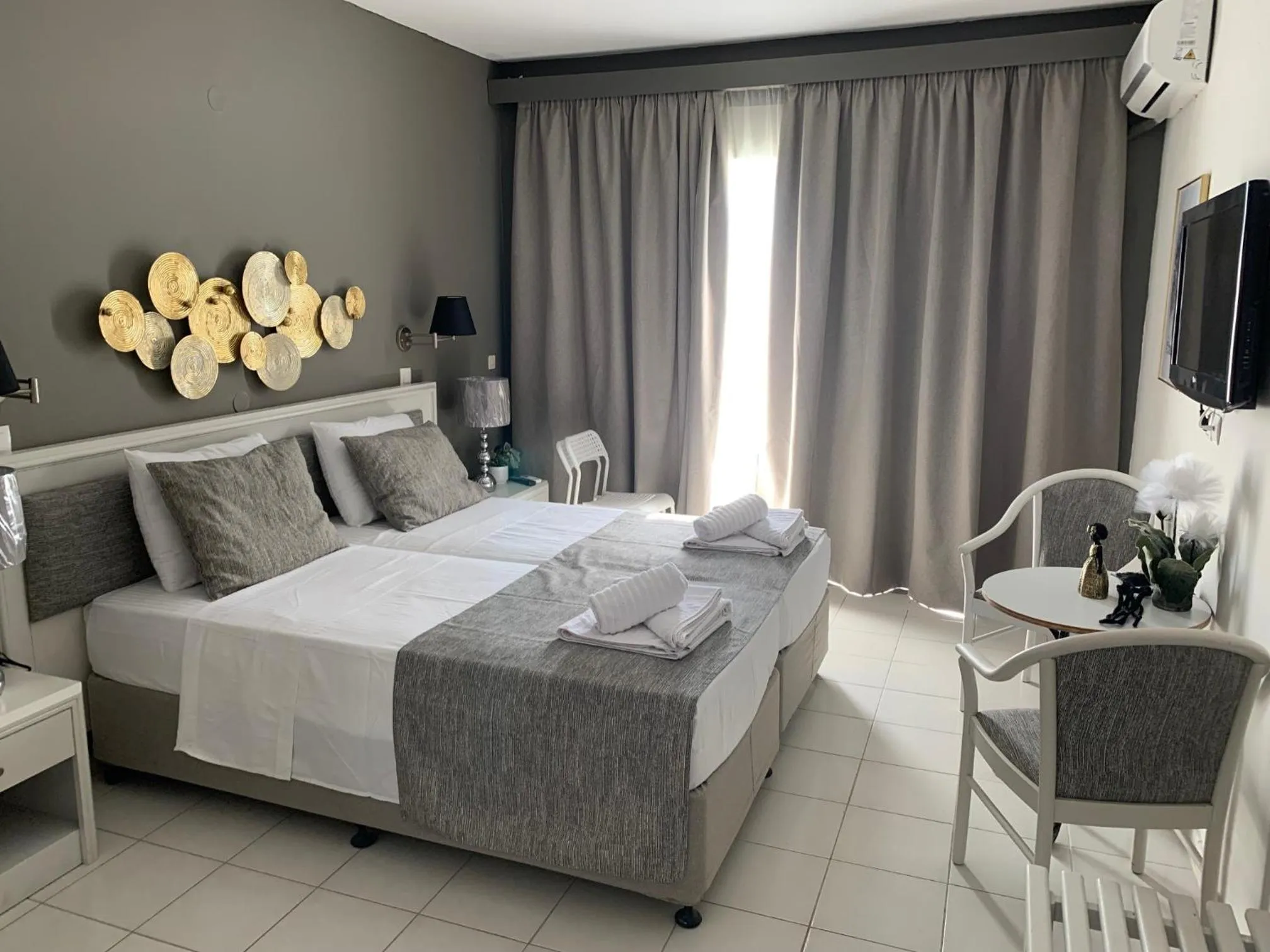 Bed in Alkyonides Boutique Hotel