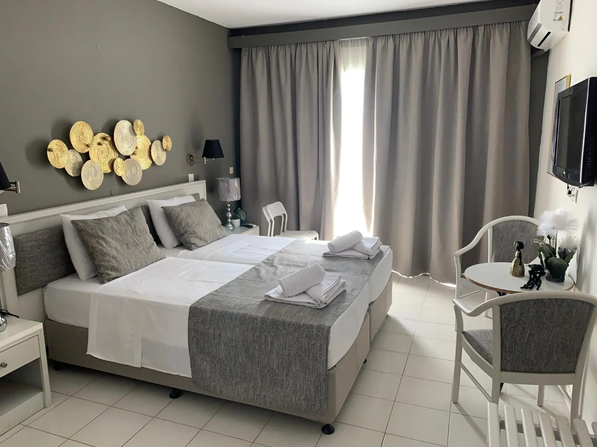 Bed in Alkyonides Boutique Hotel