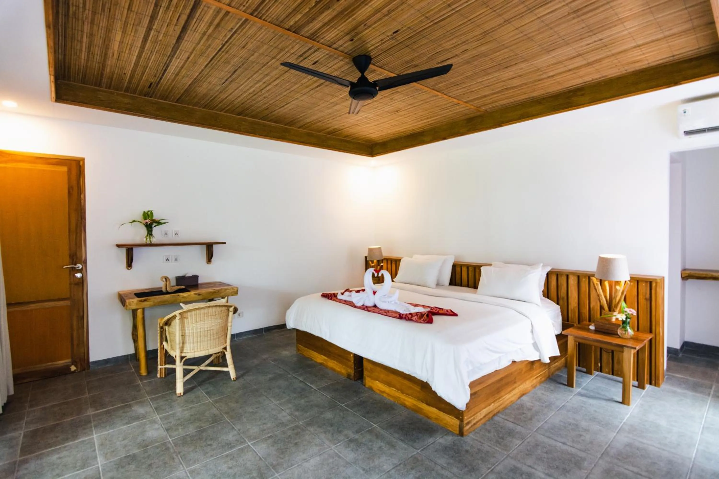 Bed in Murex Dive Resort