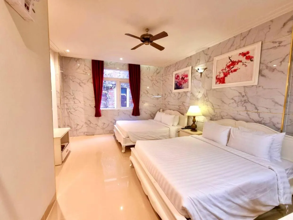 Bed in Tulip Hotel 3