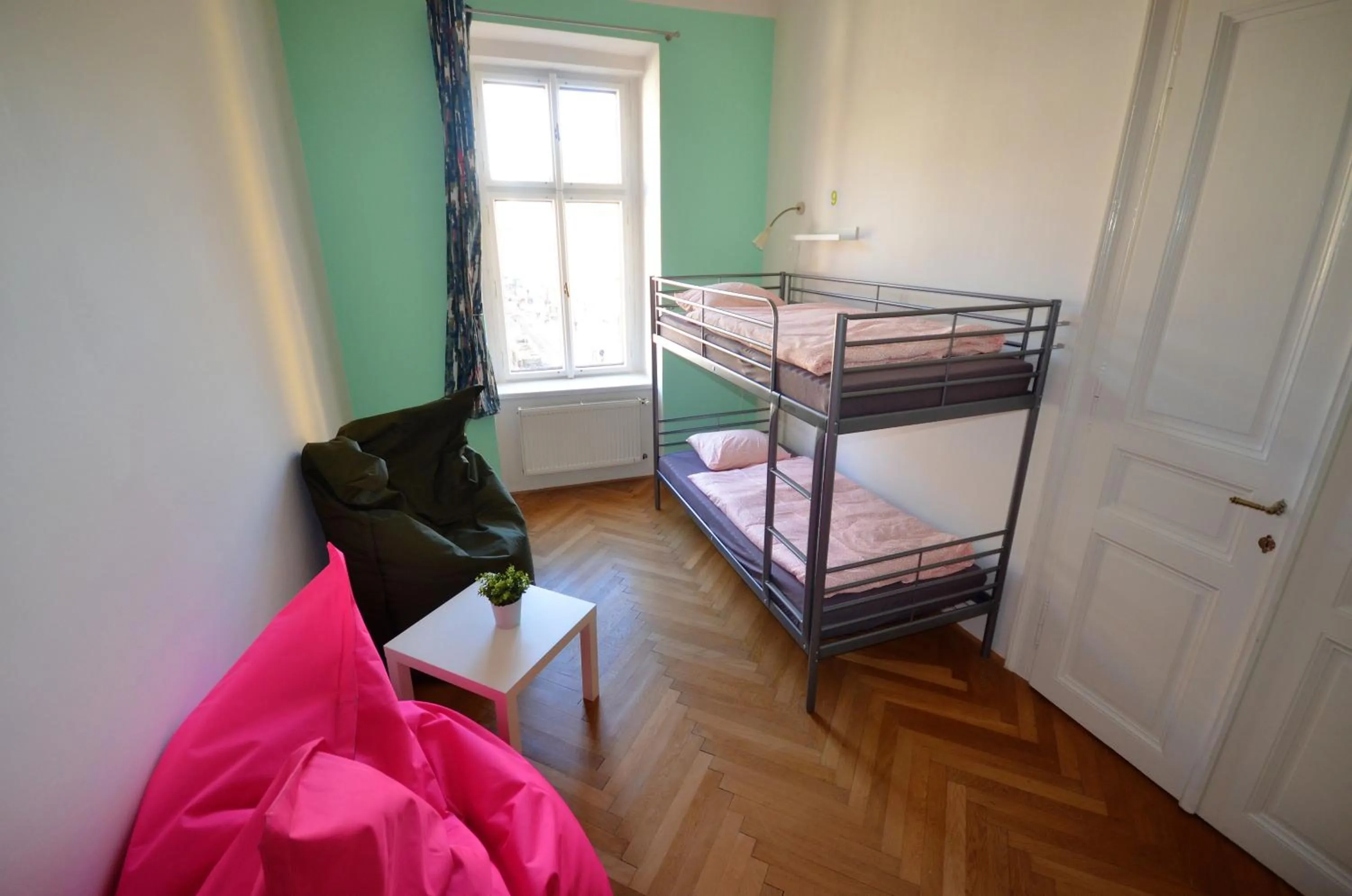 Seating area, Bed in Travel&Joy backpackers