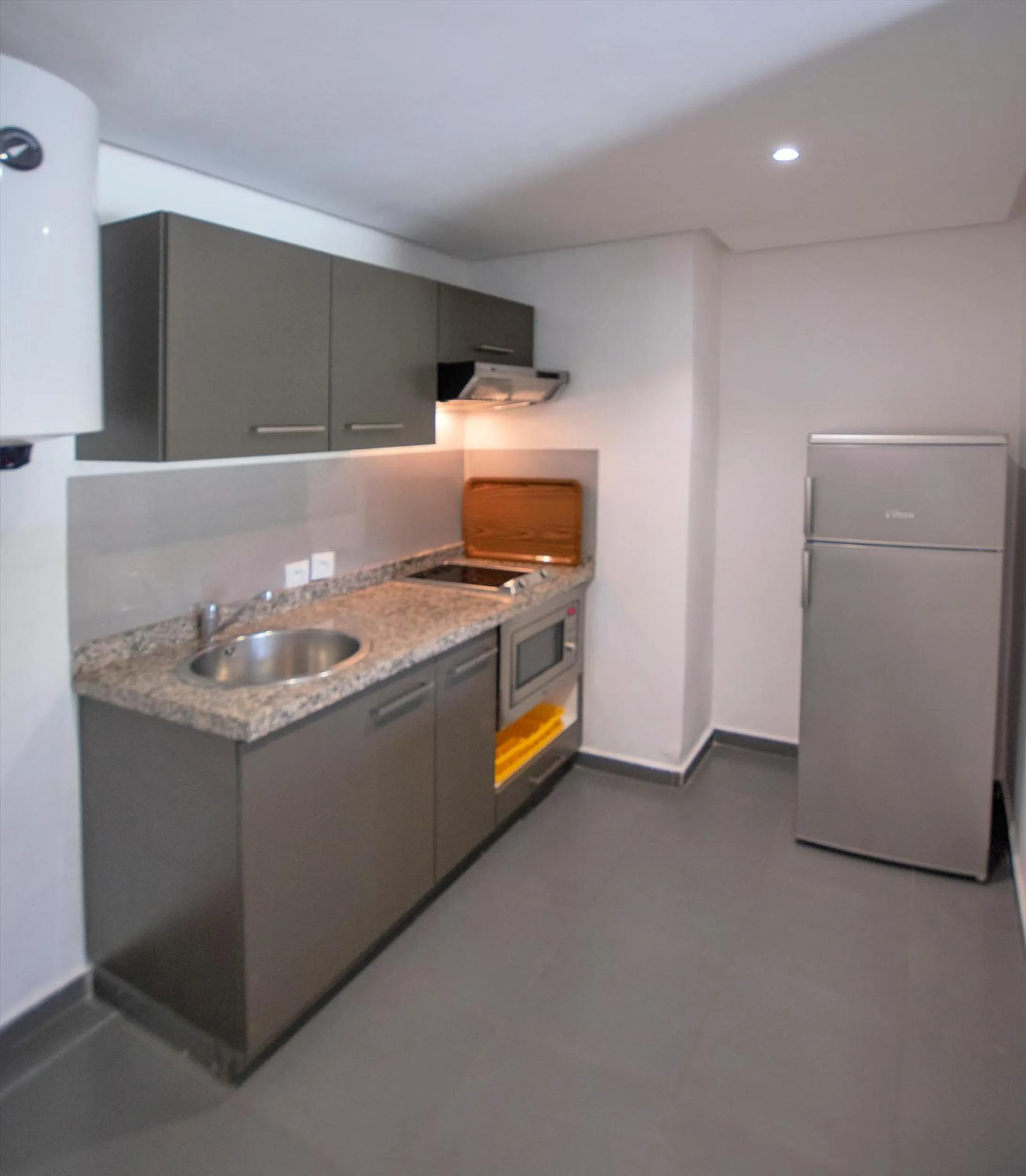 Kitchen or kitchenette in Wazo Appart-Hôtel