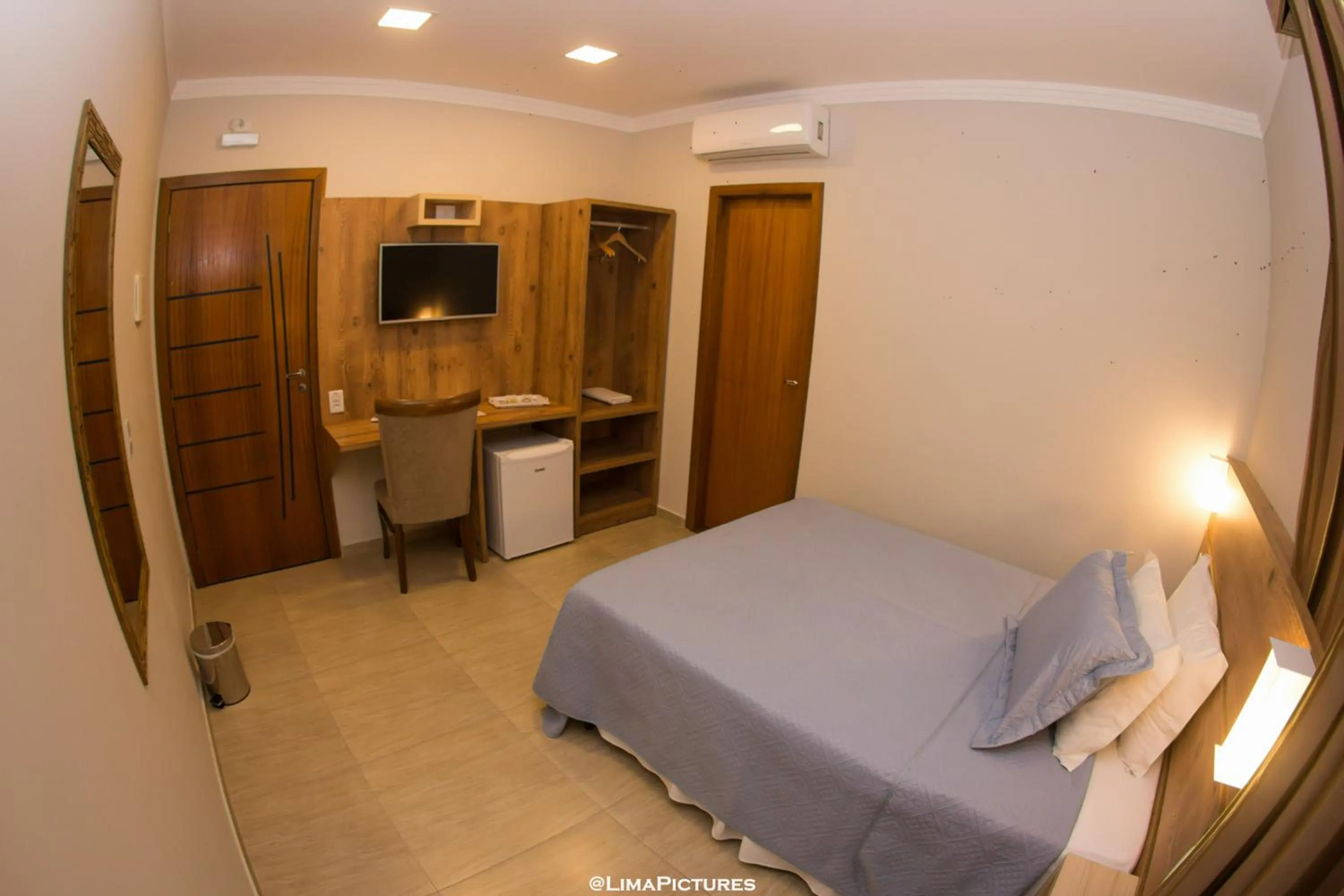 Bed in Pousada Villarejo Armação