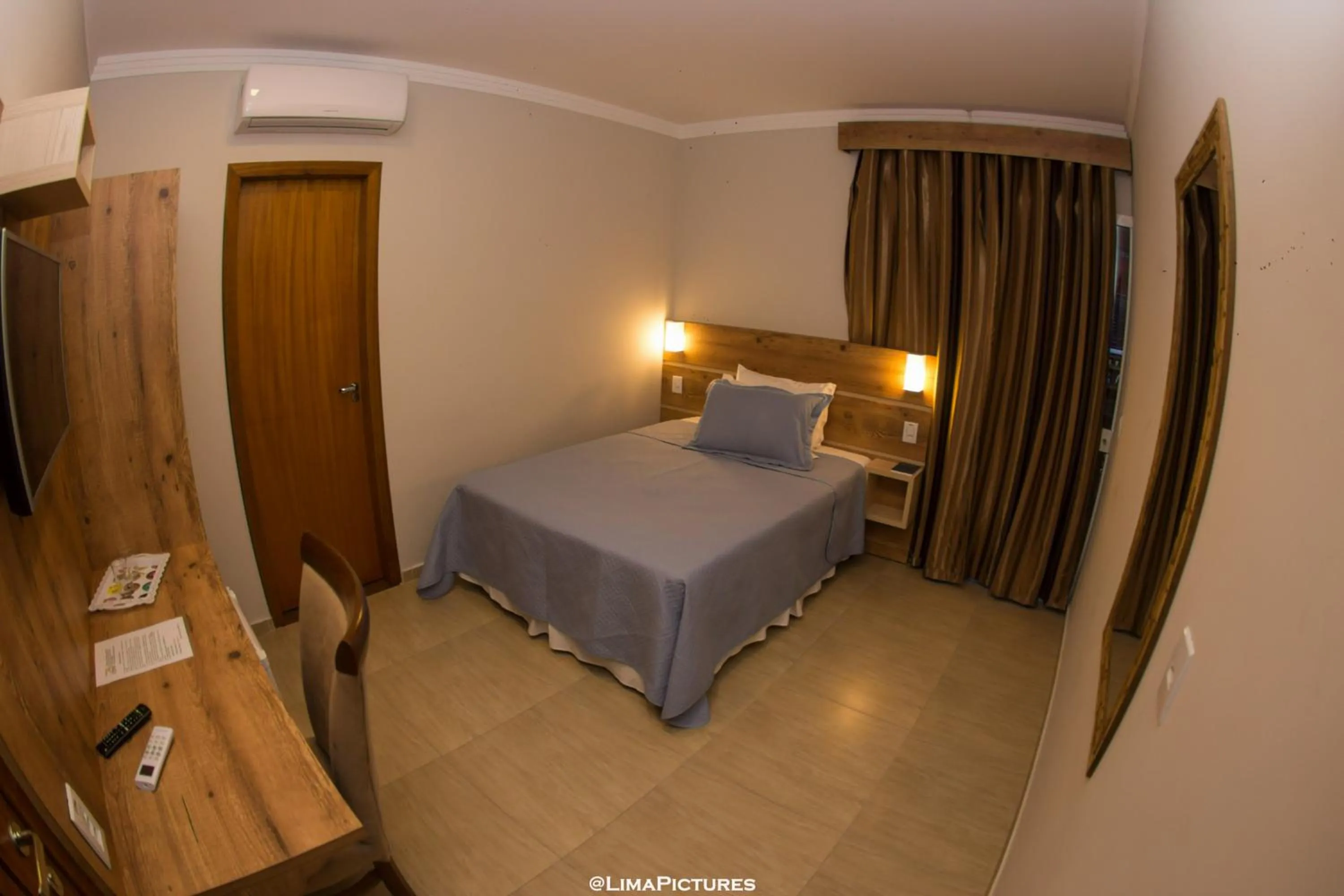 Bed in Pousada Villarejo Armação