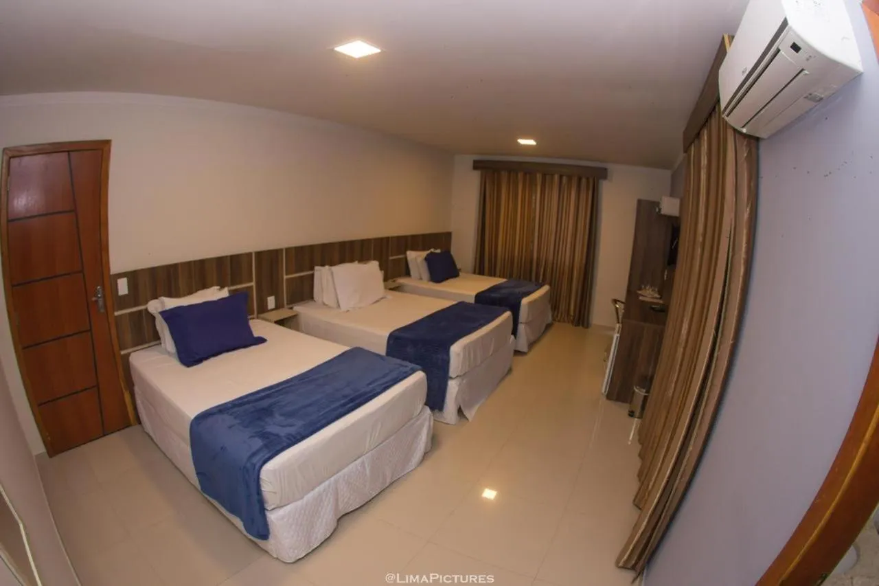 Bed in Pousada Villarejo Armação