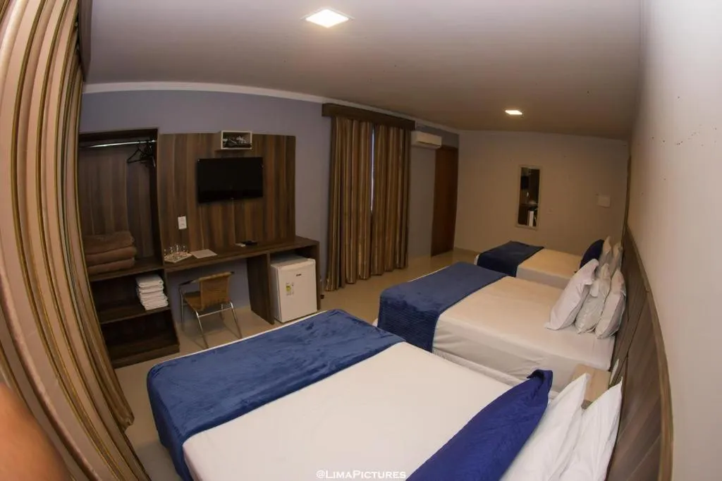 Bed in Pousada Villarejo Armação