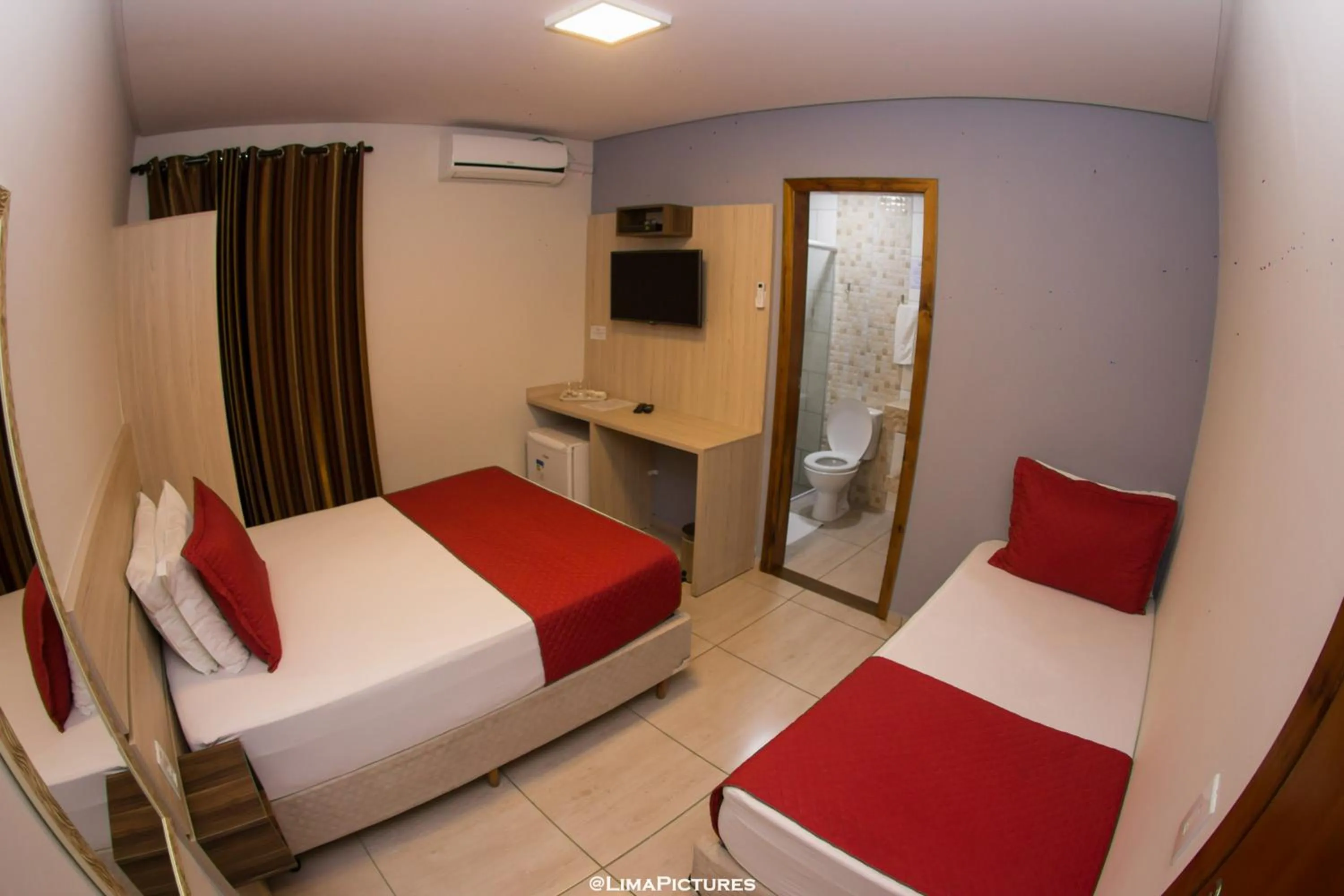 Bed in Pousada Villarejo Armação