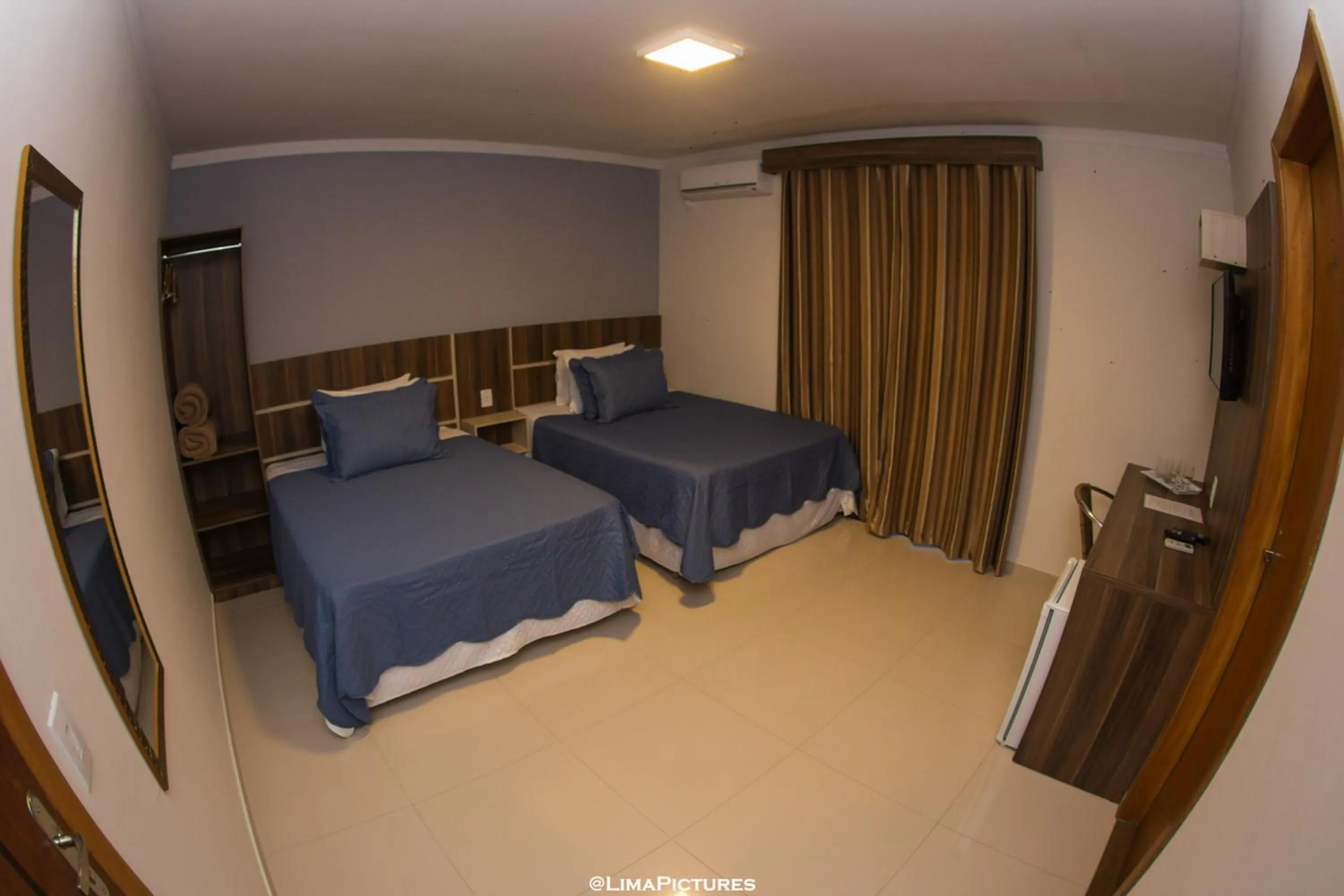 Bed in Pousada Villarejo Armação