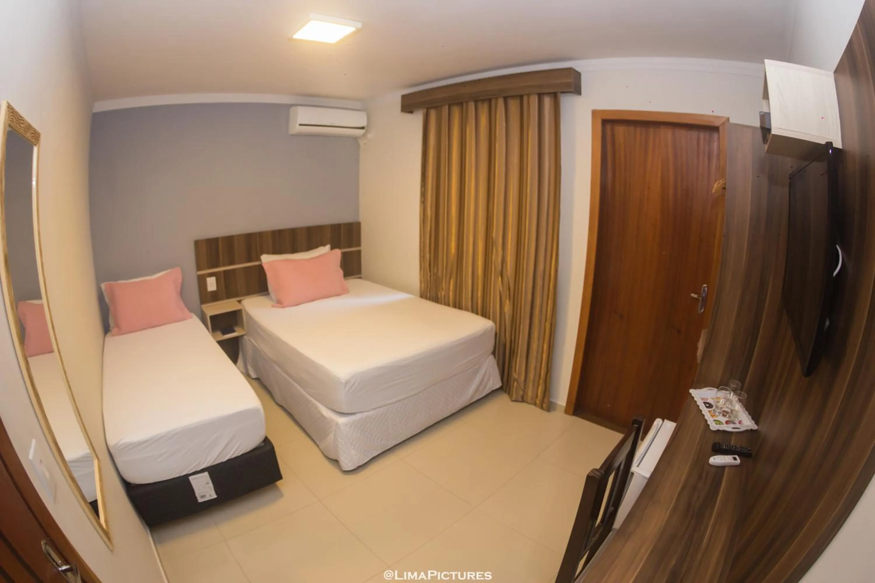 Bed in Pousada Villarejo Armação