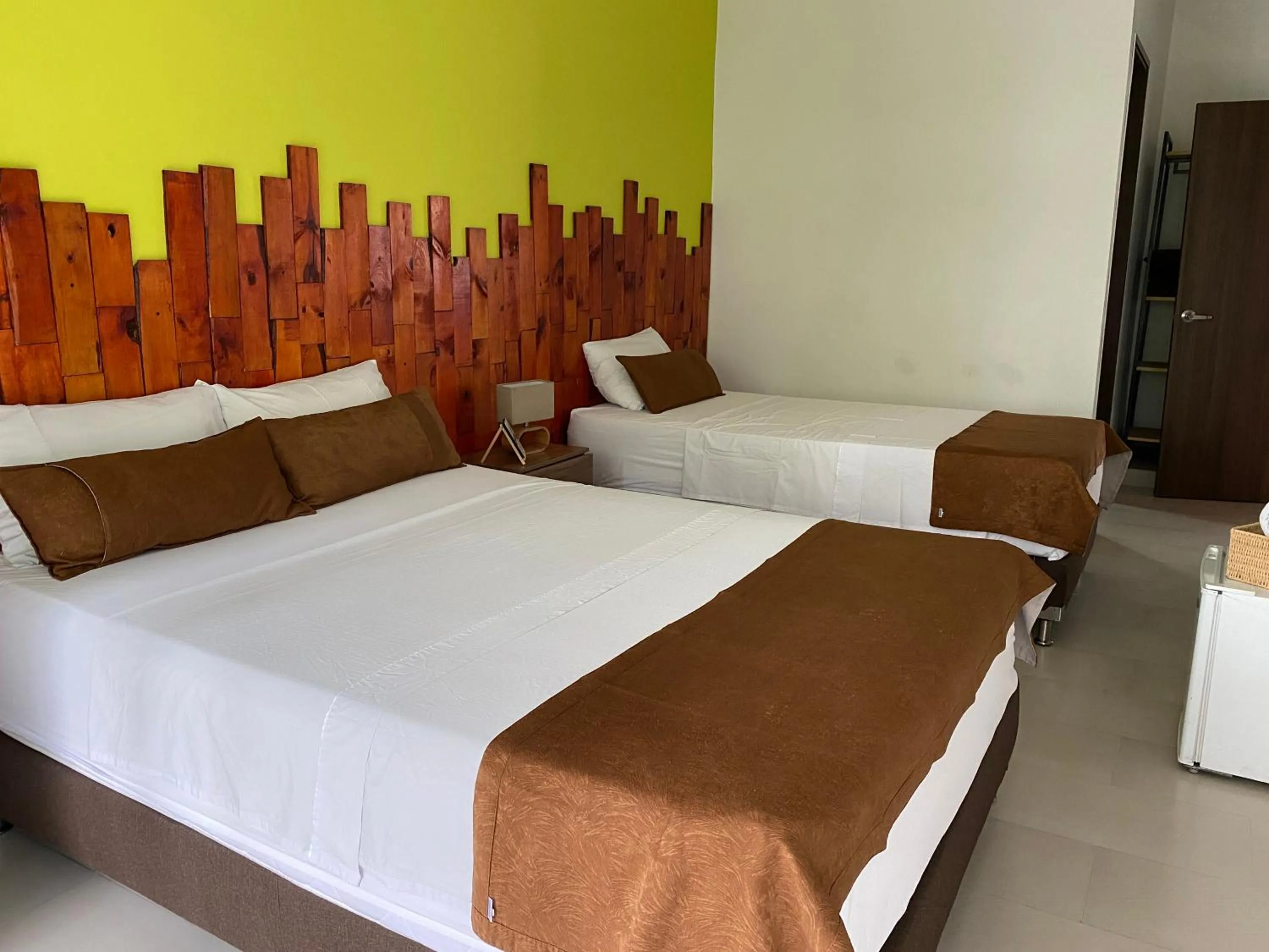 Bed in Rivière Boutique Hotel