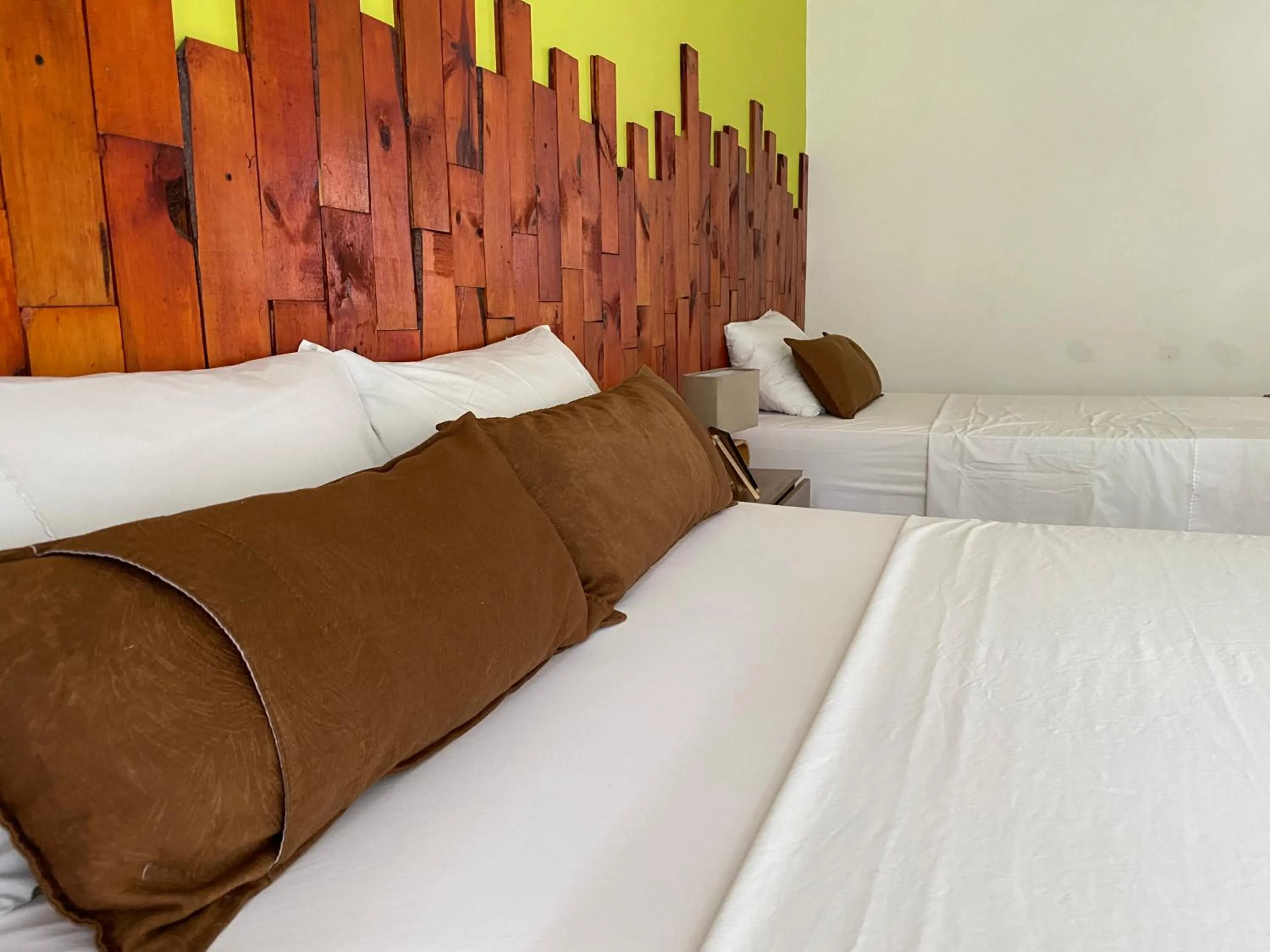 Bed in Rivière Boutique Hotel