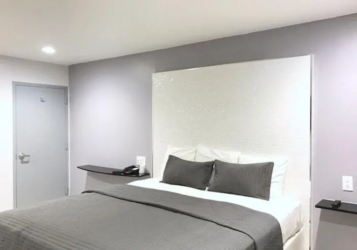 Bed in Ramsey Inn & Suites