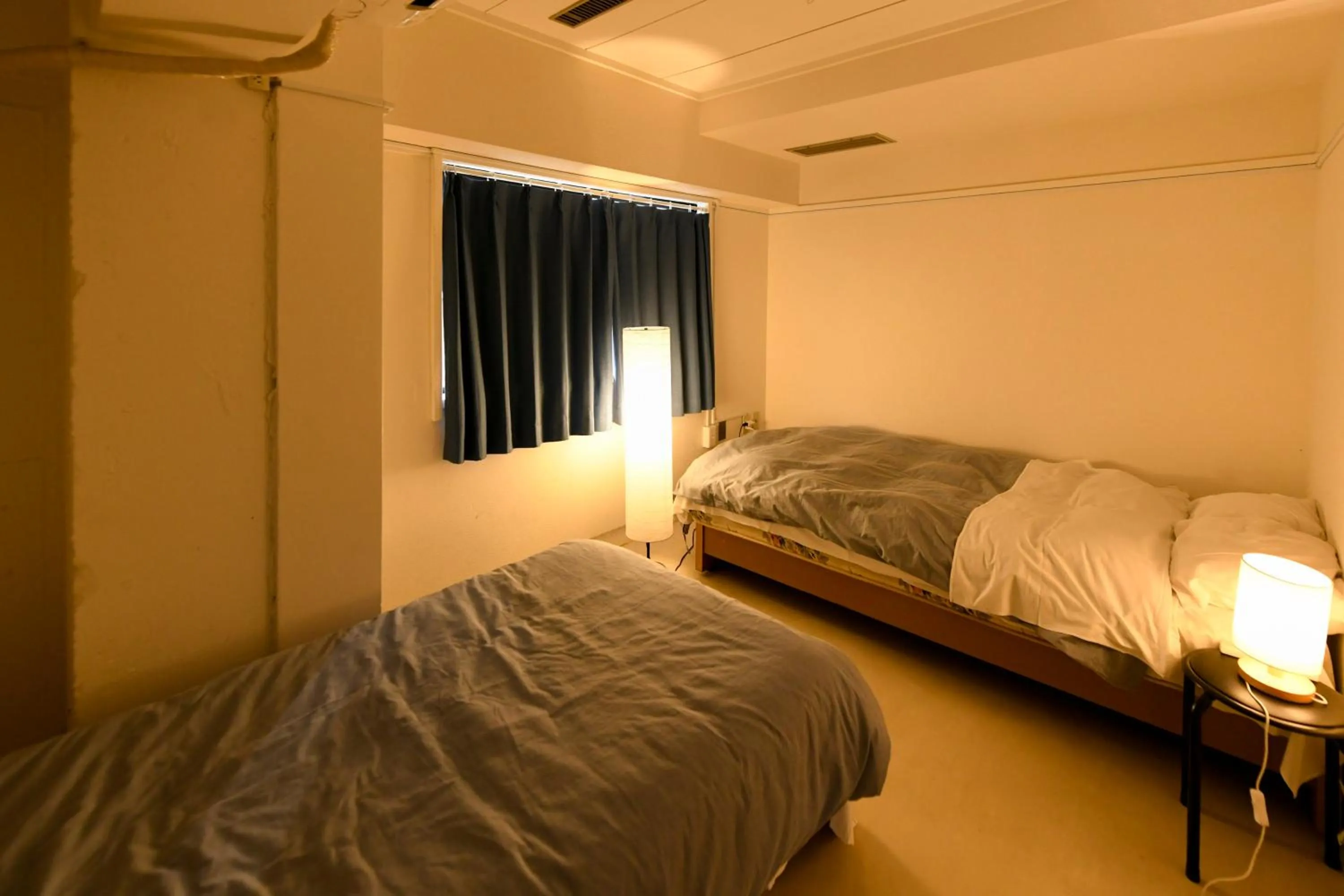 Bed in Guest House M104 Kagoshima