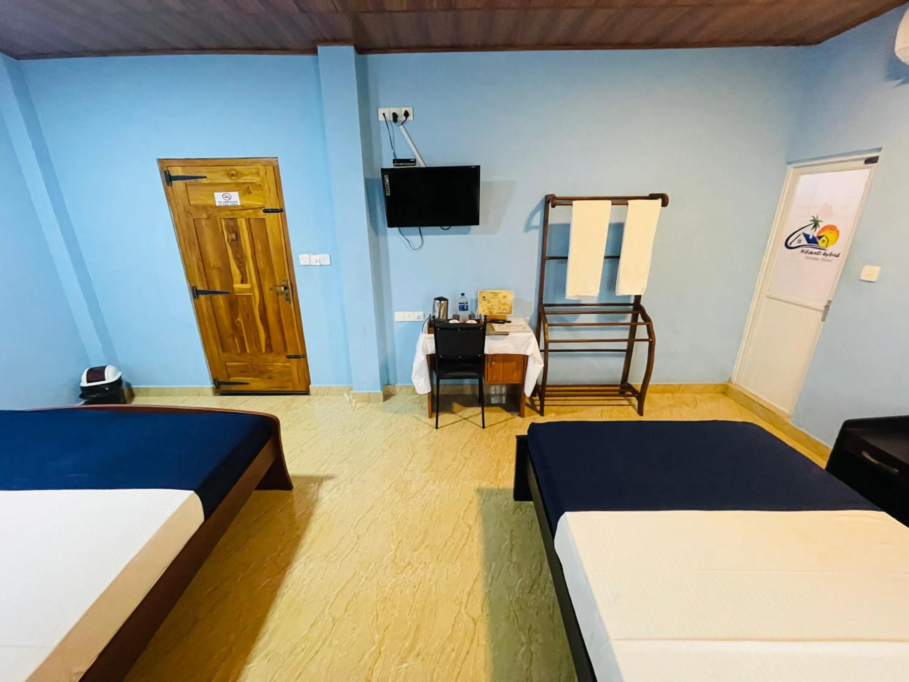 Bed in Nilaveli Hybrid Holiday Hotel