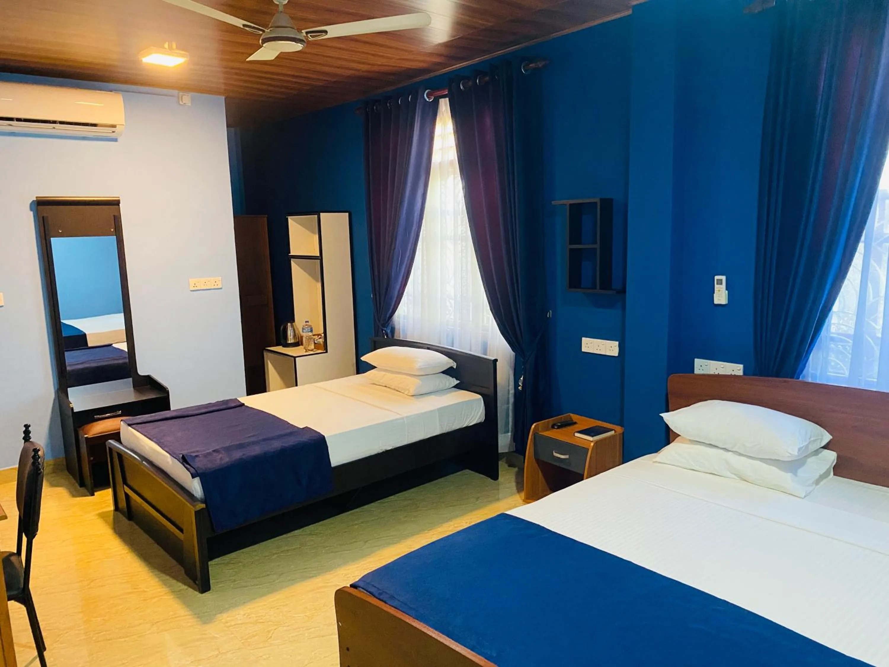 Bed in Nilaveli Hybrid Holiday Hotel