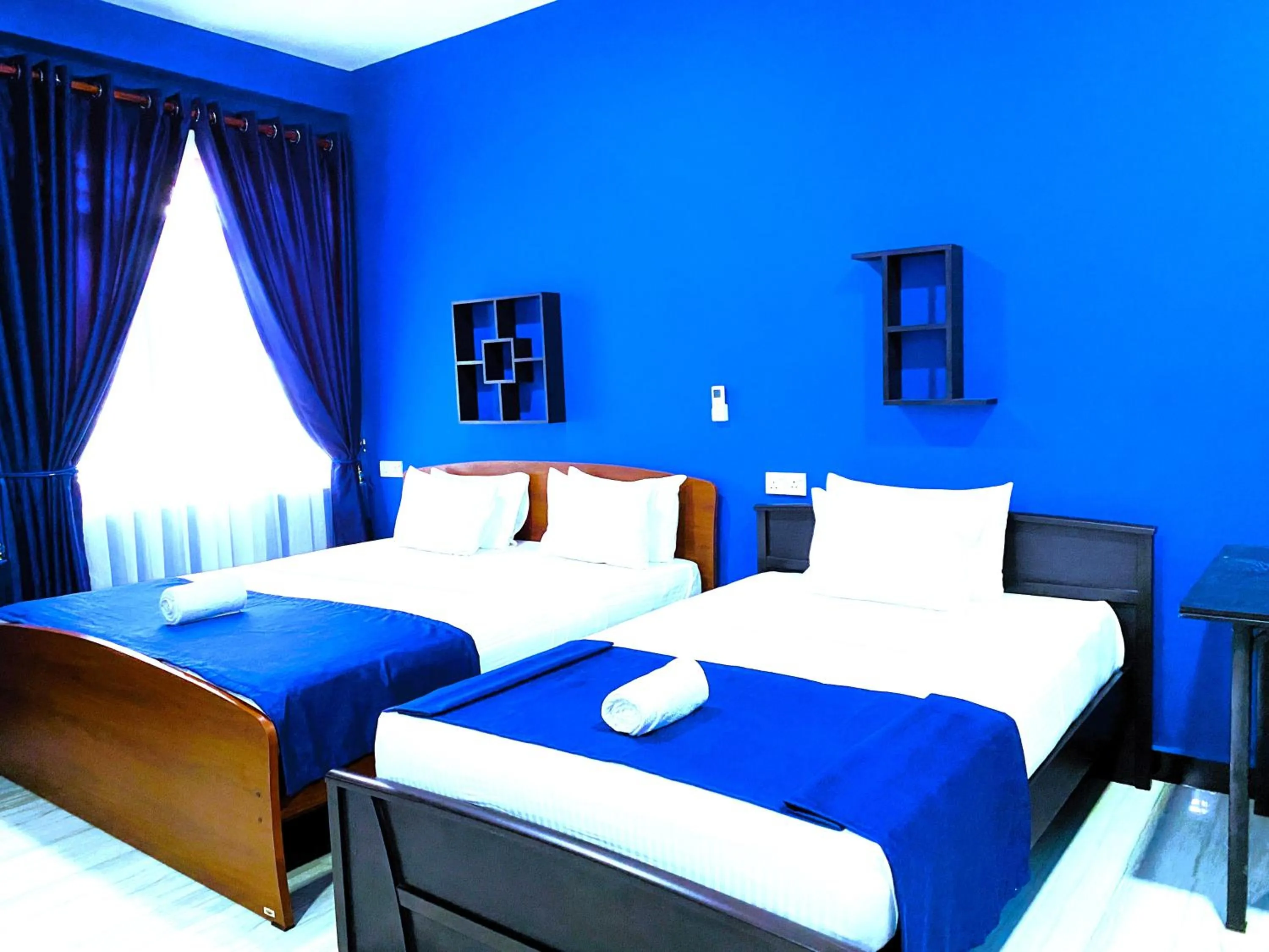 Bed in Nilaveli Hybrid Holiday Hotel