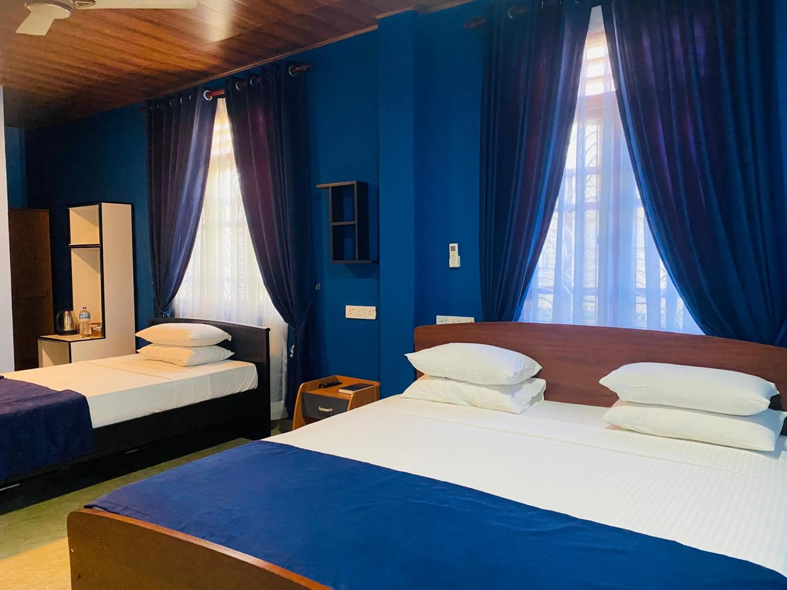 Bed in Nilaveli Hybrid Holiday Hotel