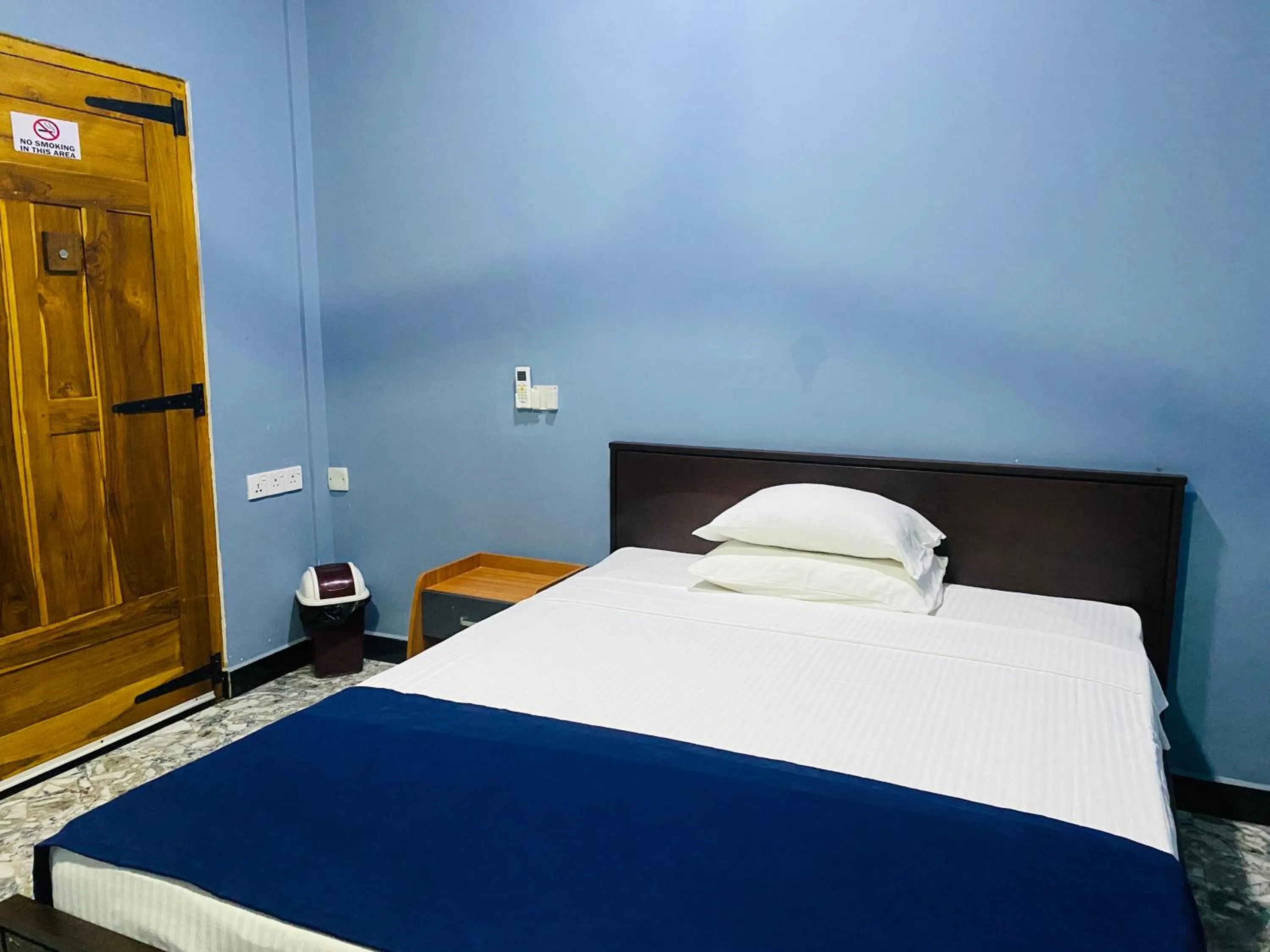 Bed in Nilaveli Hybrid Holiday Hotel