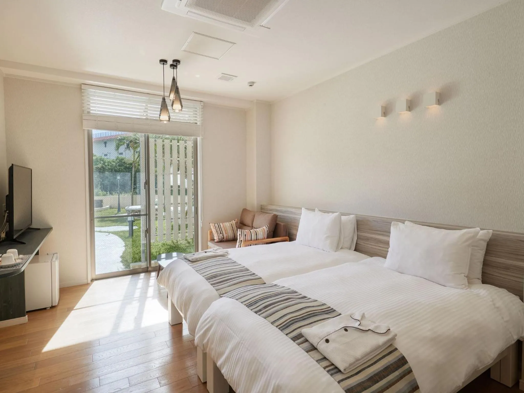 Photo of the whole room, Bed in La Casa Panacea Okinawa Resort