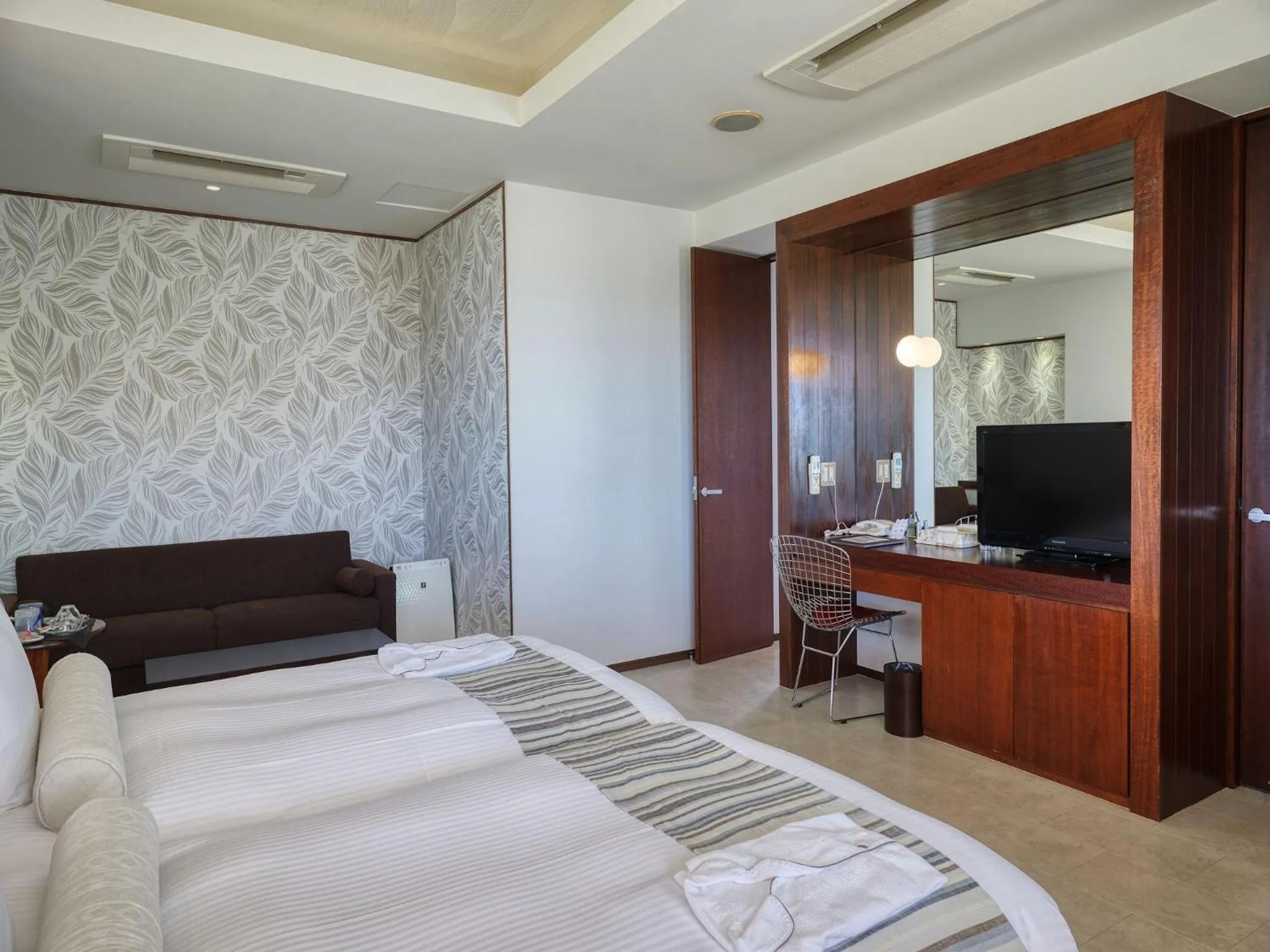 Photo of the whole room, Bed in La Casa Panacea Okinawa Resort