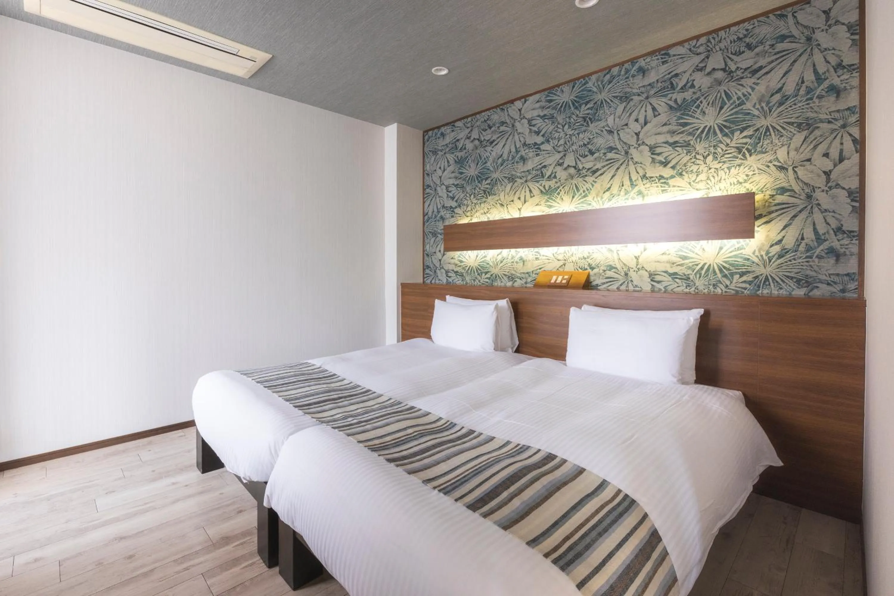 Bed in La Casa Panacea Okinawa Resort