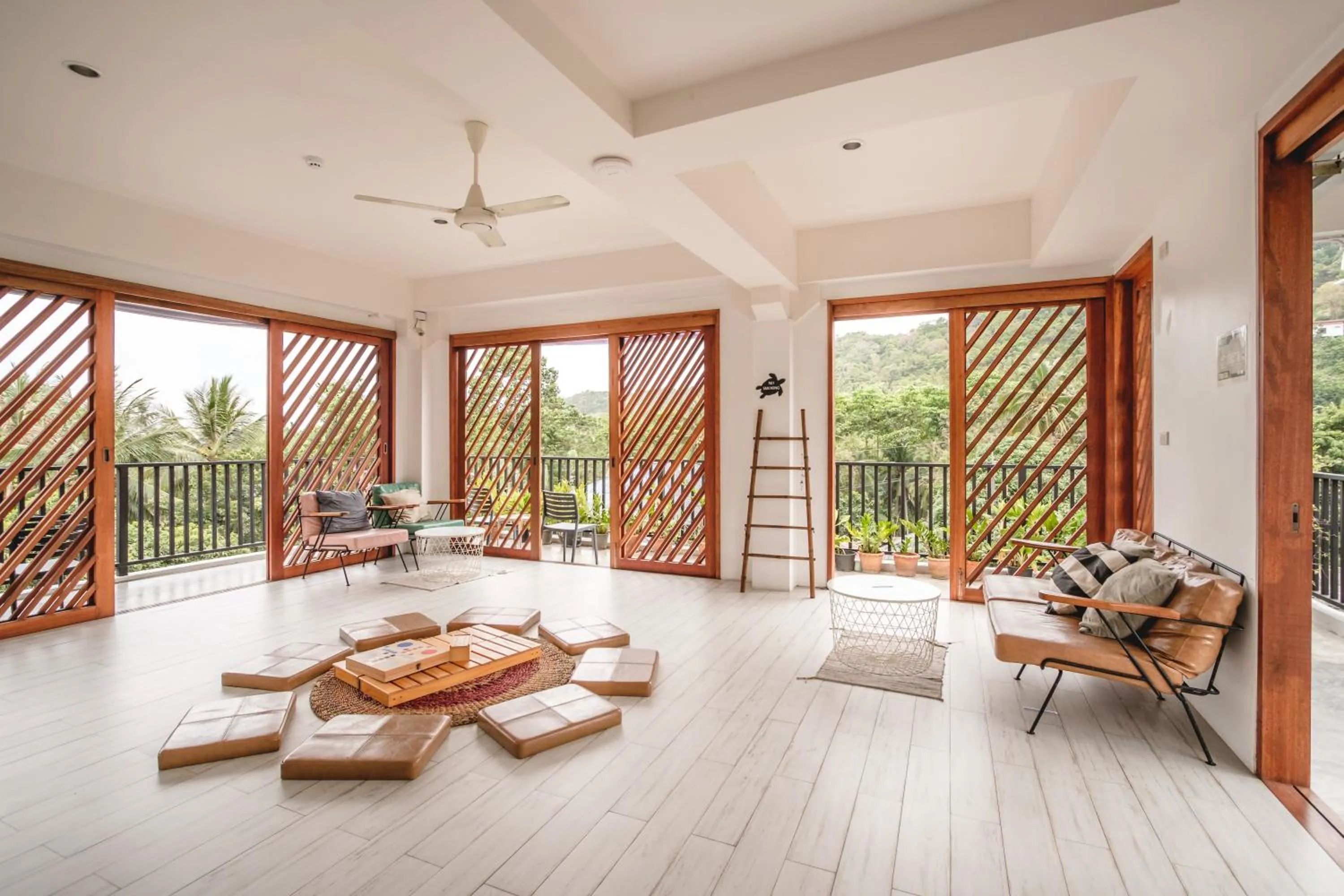 Communal lounge/ TV room in The Dearly Koh Tao Hostel-PADI 5 Star Dive Resort