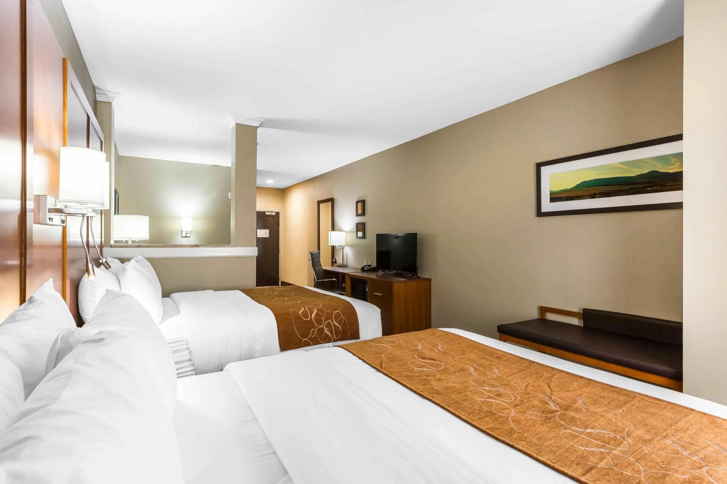 Bed in Comfort Suites - University