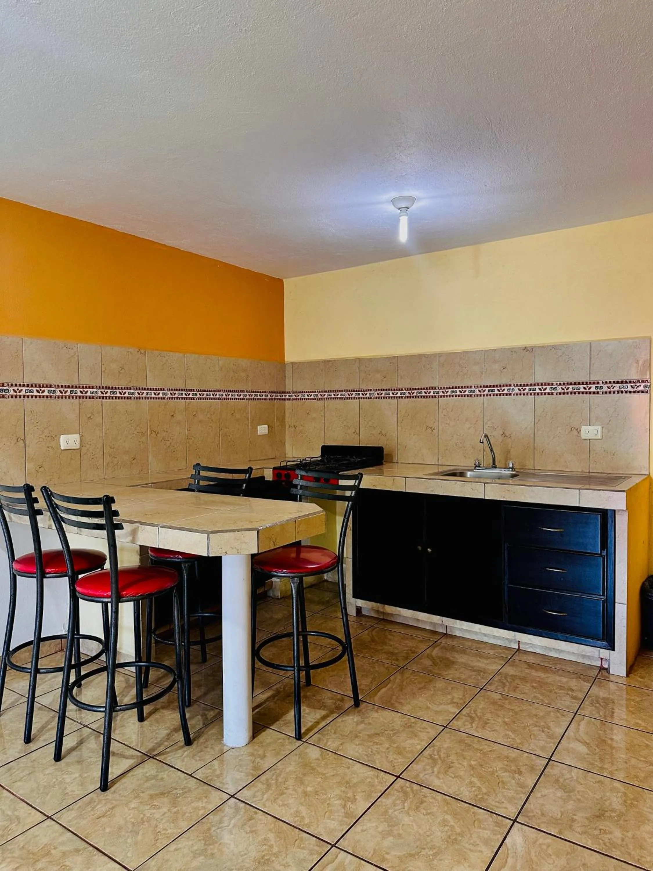 Kitchen or kitchenette in Hotel & Suites Cerro Roj0