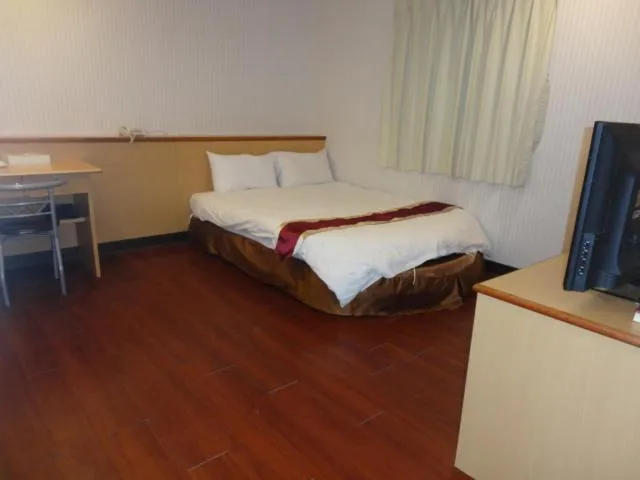 Bed in Yi Pin Yuan Hotel