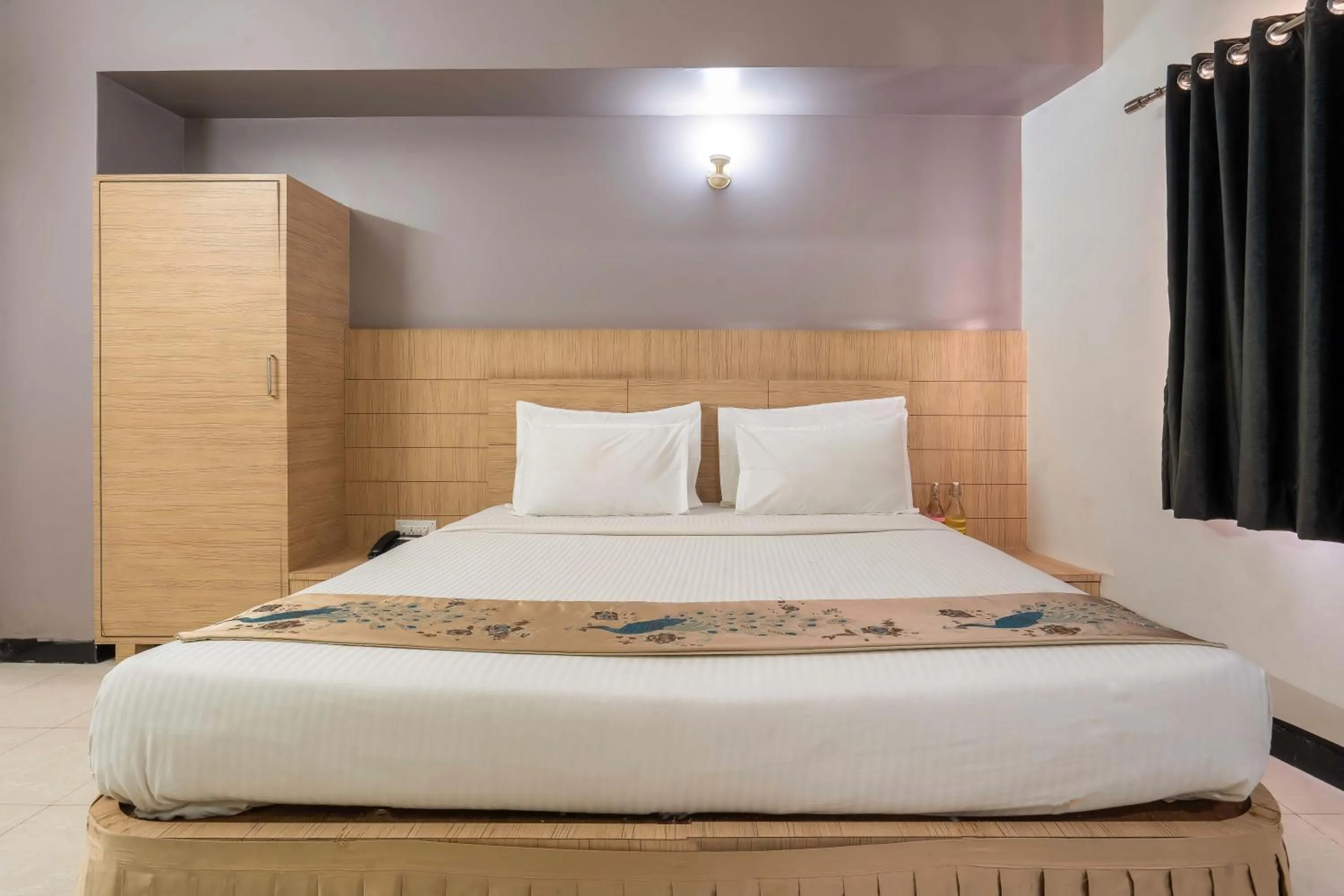 Bed in Hotel Ashish Palace