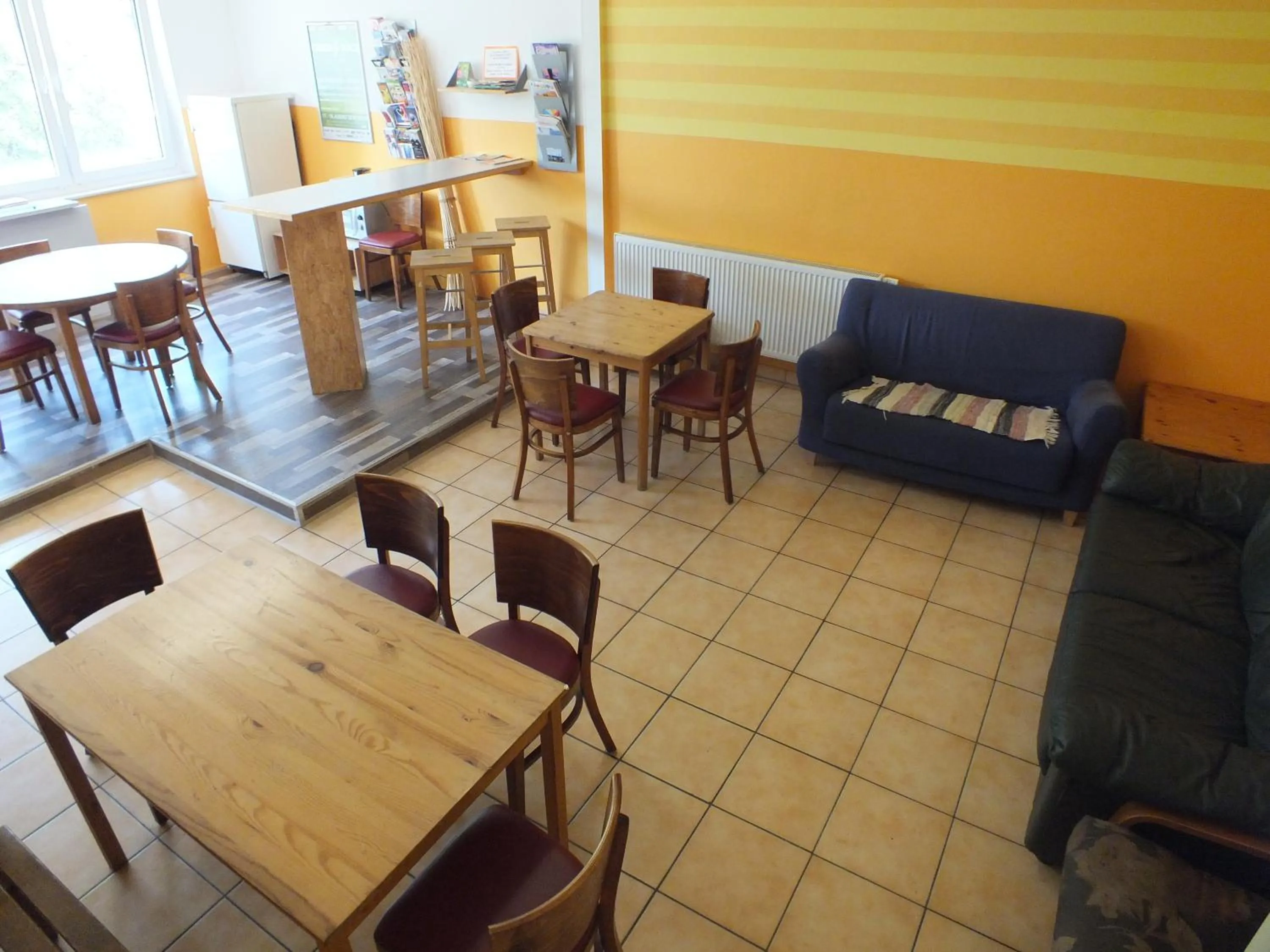 Communal lounge/ TV room in Max Hostel