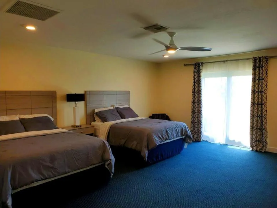 Bed in The Rivers Edge Motel