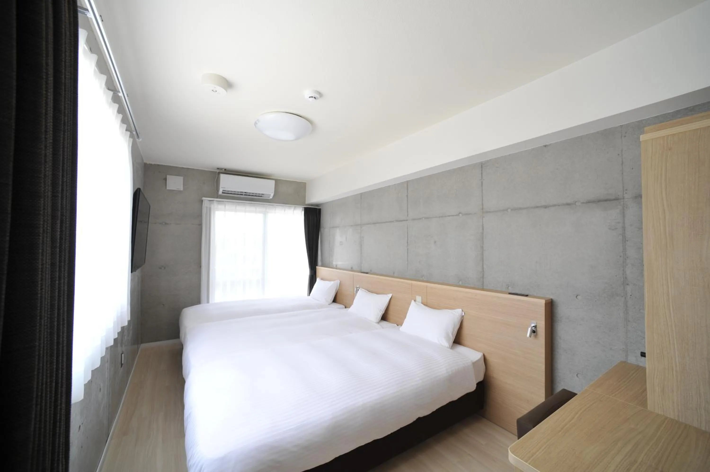 Bed in The BREAKFAST HOTEL PORTO Ishigakijima