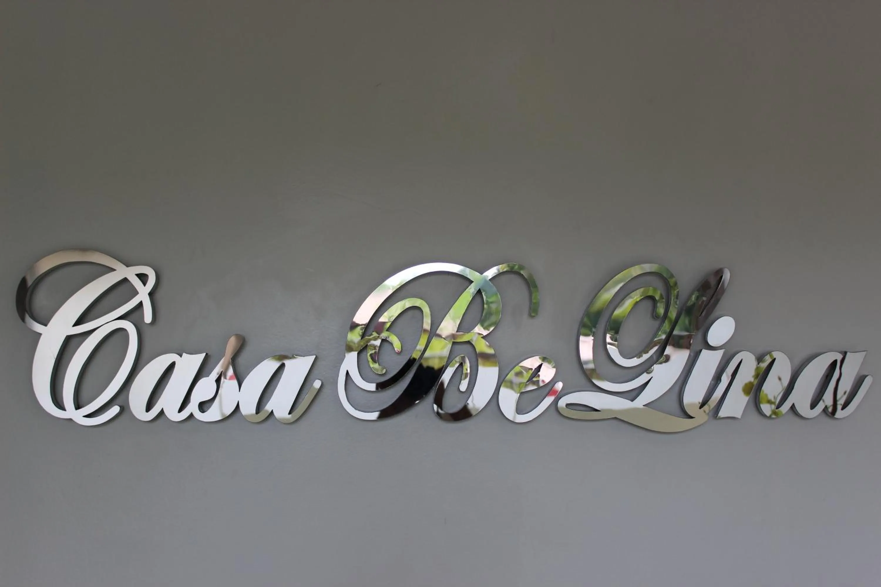 Property logo or sign in Casa Belina