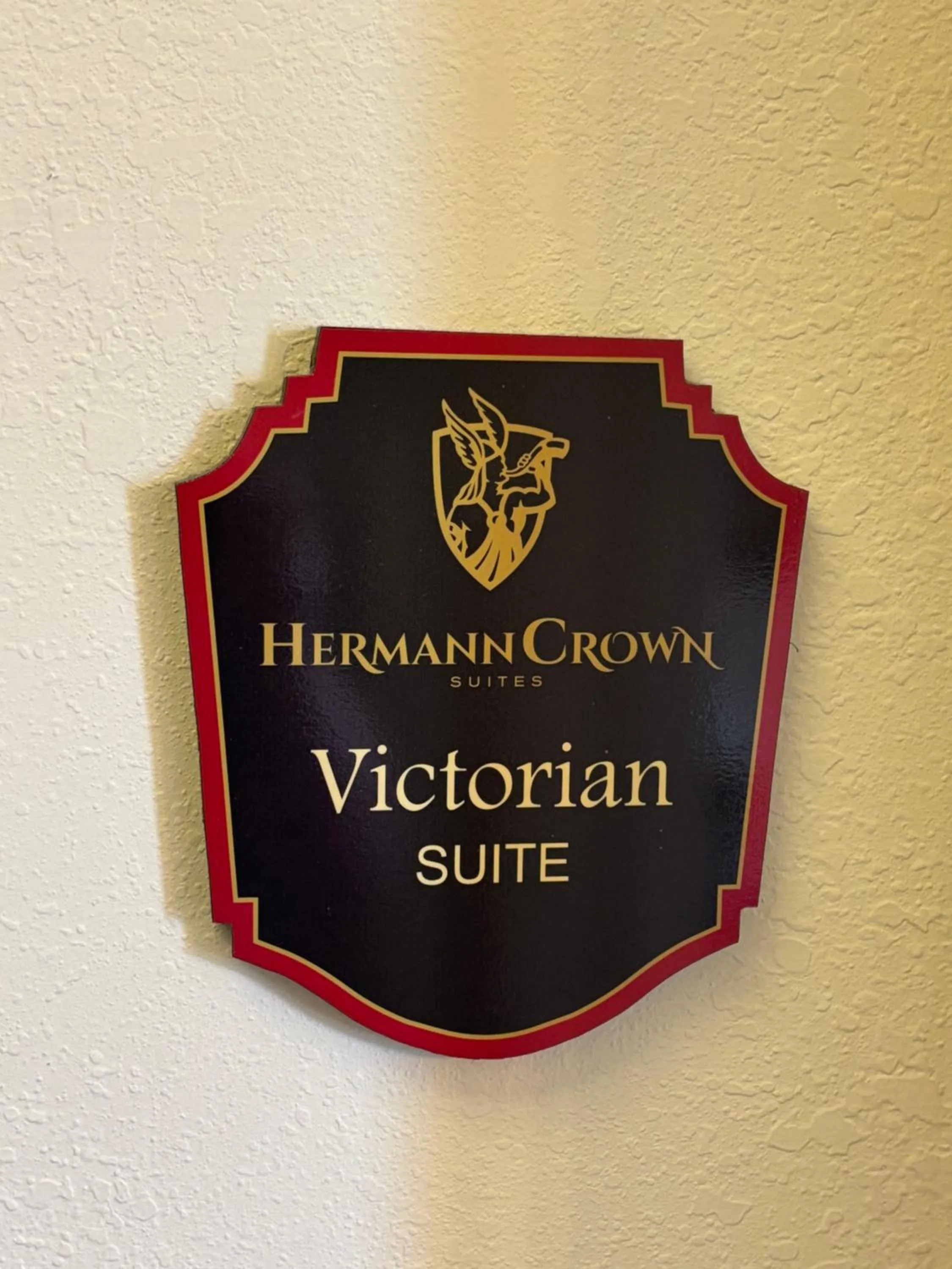 Property logo or sign in Hermann Crown Suites