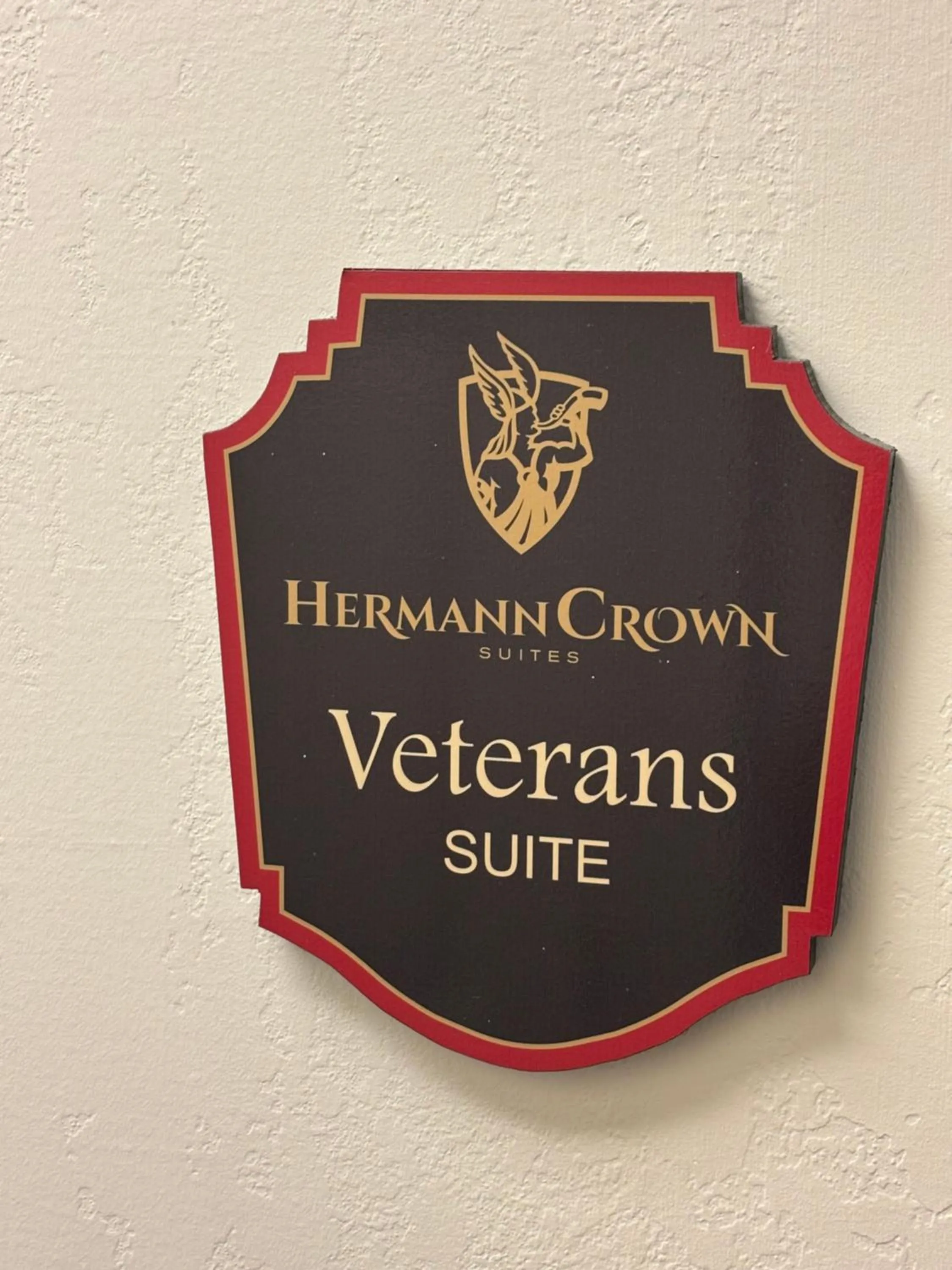 Property logo or sign in Hermann Crown Suites