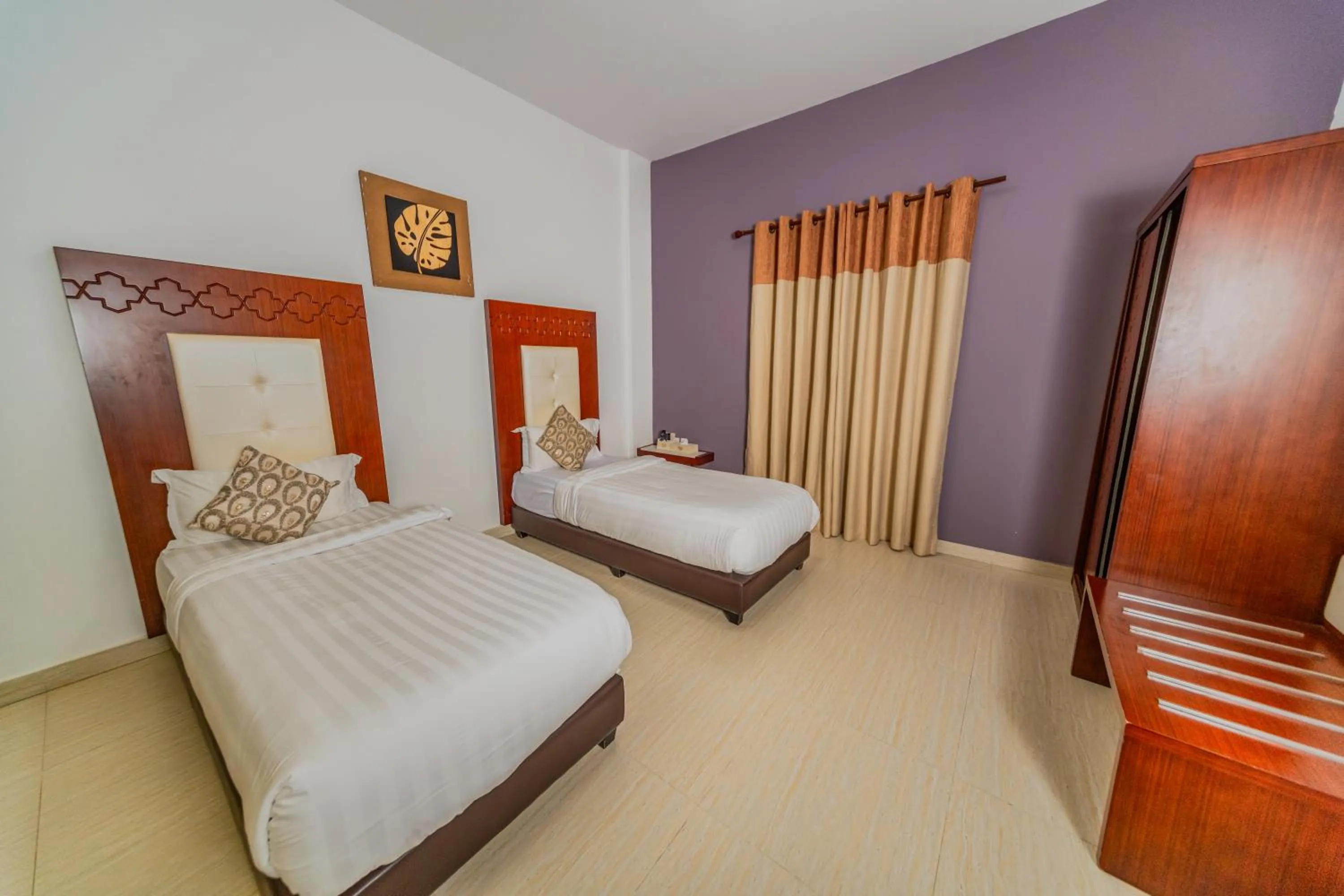 Bed in Zaki Hotel Apartment
