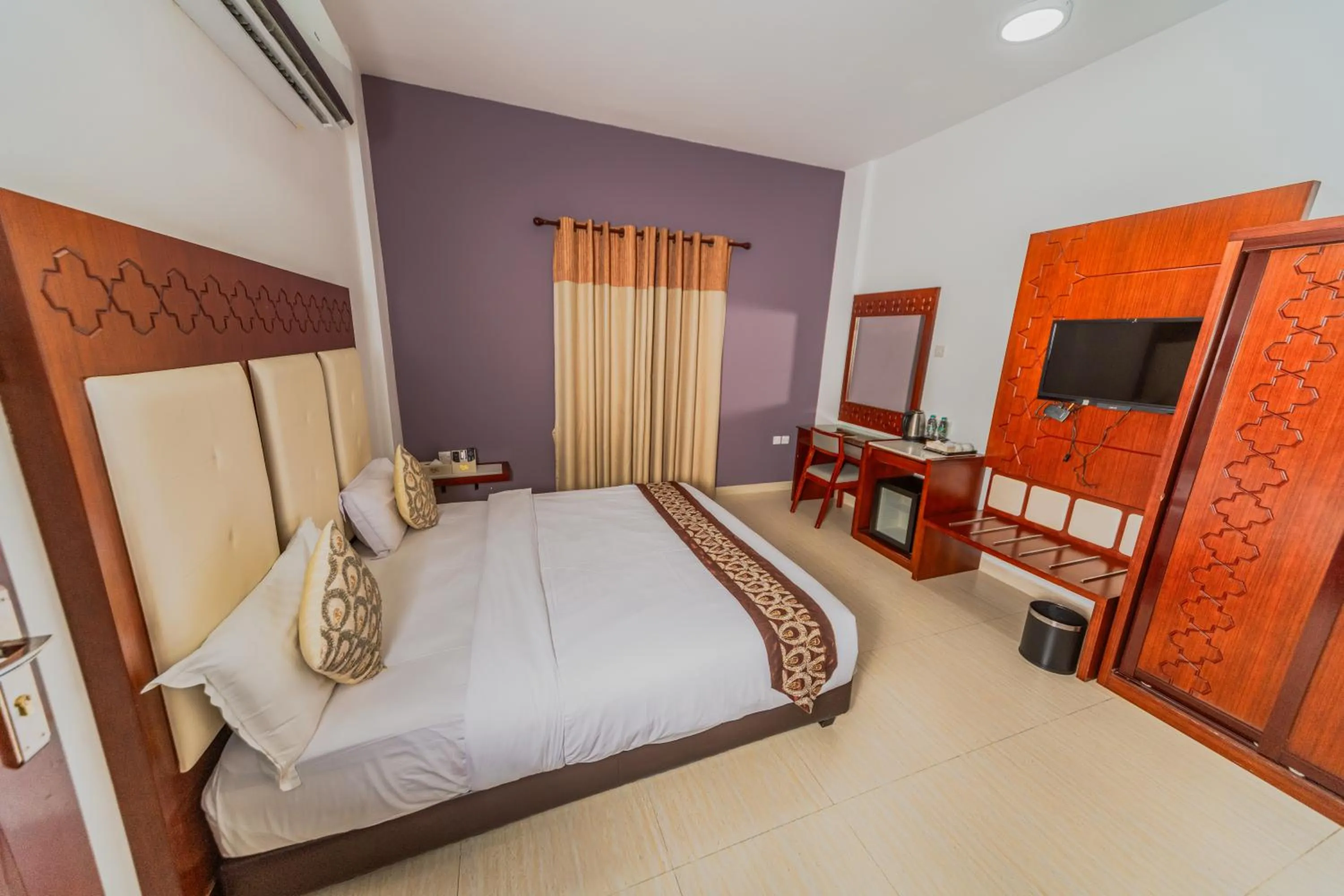Bed in Zaki Hotel Apartment