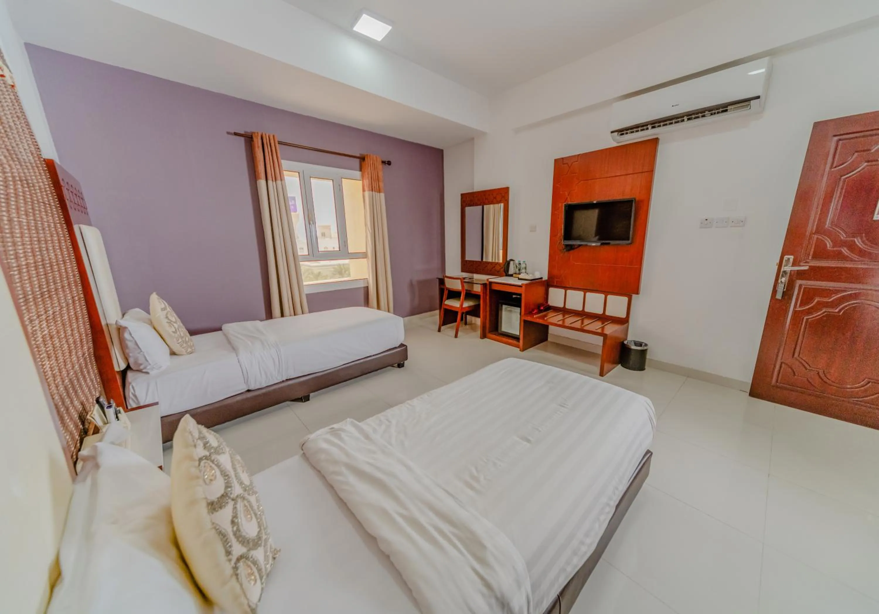 Bed in Zaki Hotel Apartment