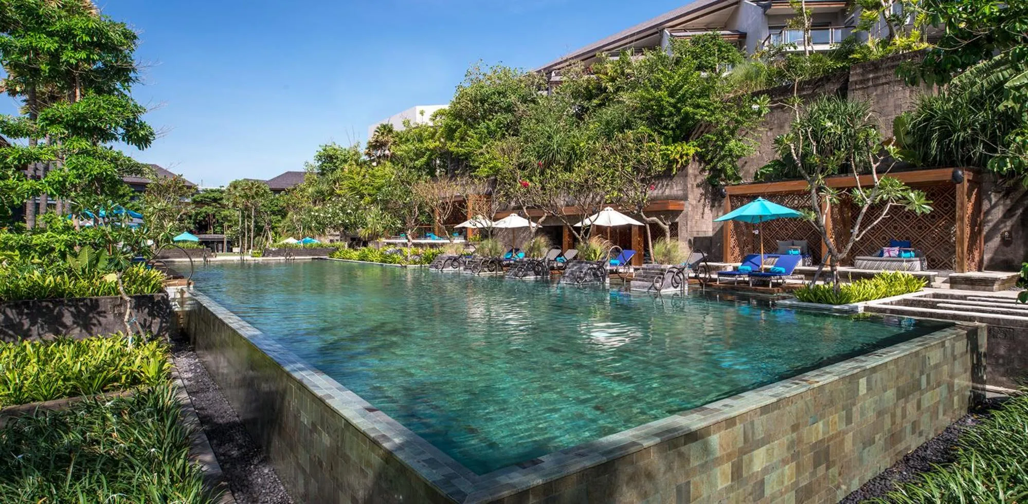 Swimming pool in Hotel Indigo Bali Seminyak Beach by IHG