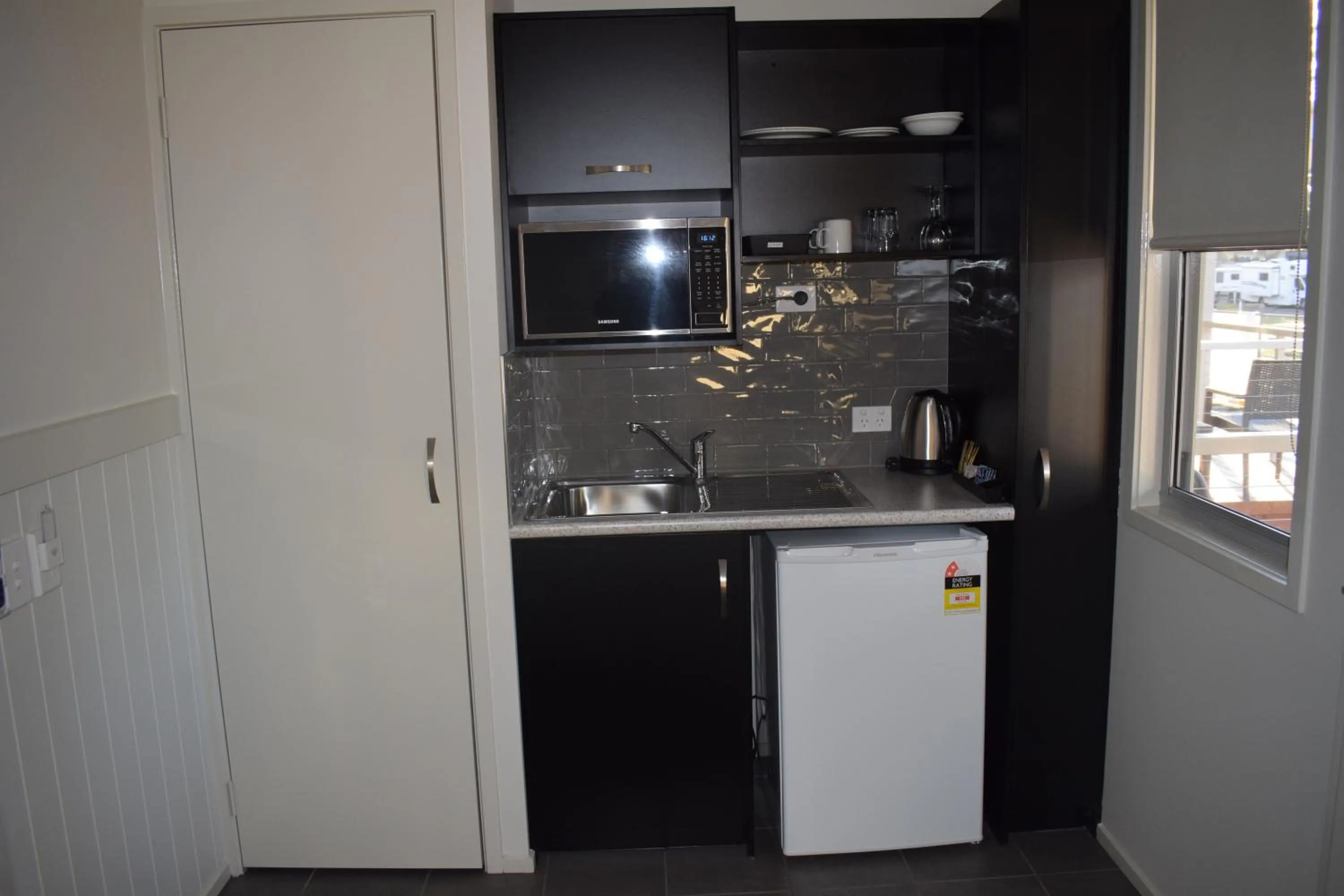 Kitchen or kitchenette in NRMA Port Macquarie Breakwall Holiday Park