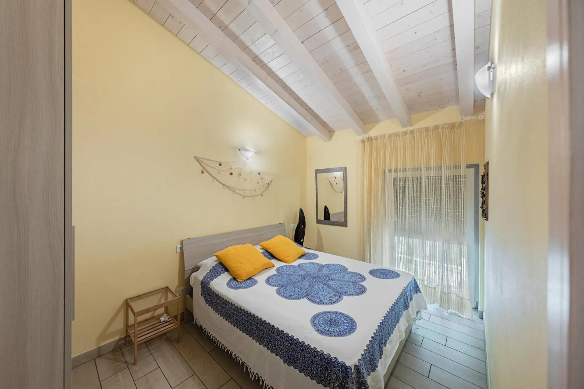 Bed in Mimosa Apartments