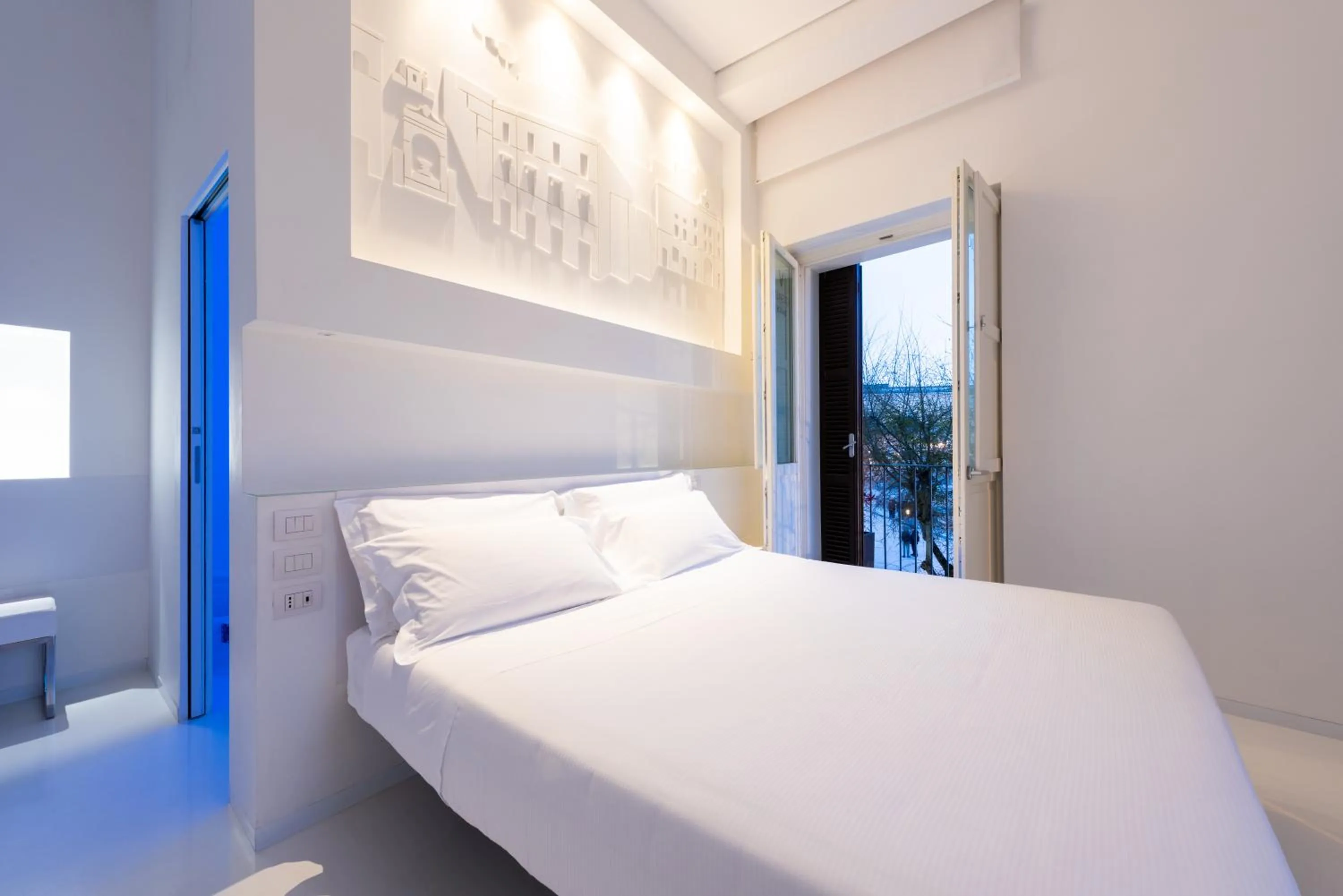 Bed in Vittorio Veneto Matera Luxury Rooms