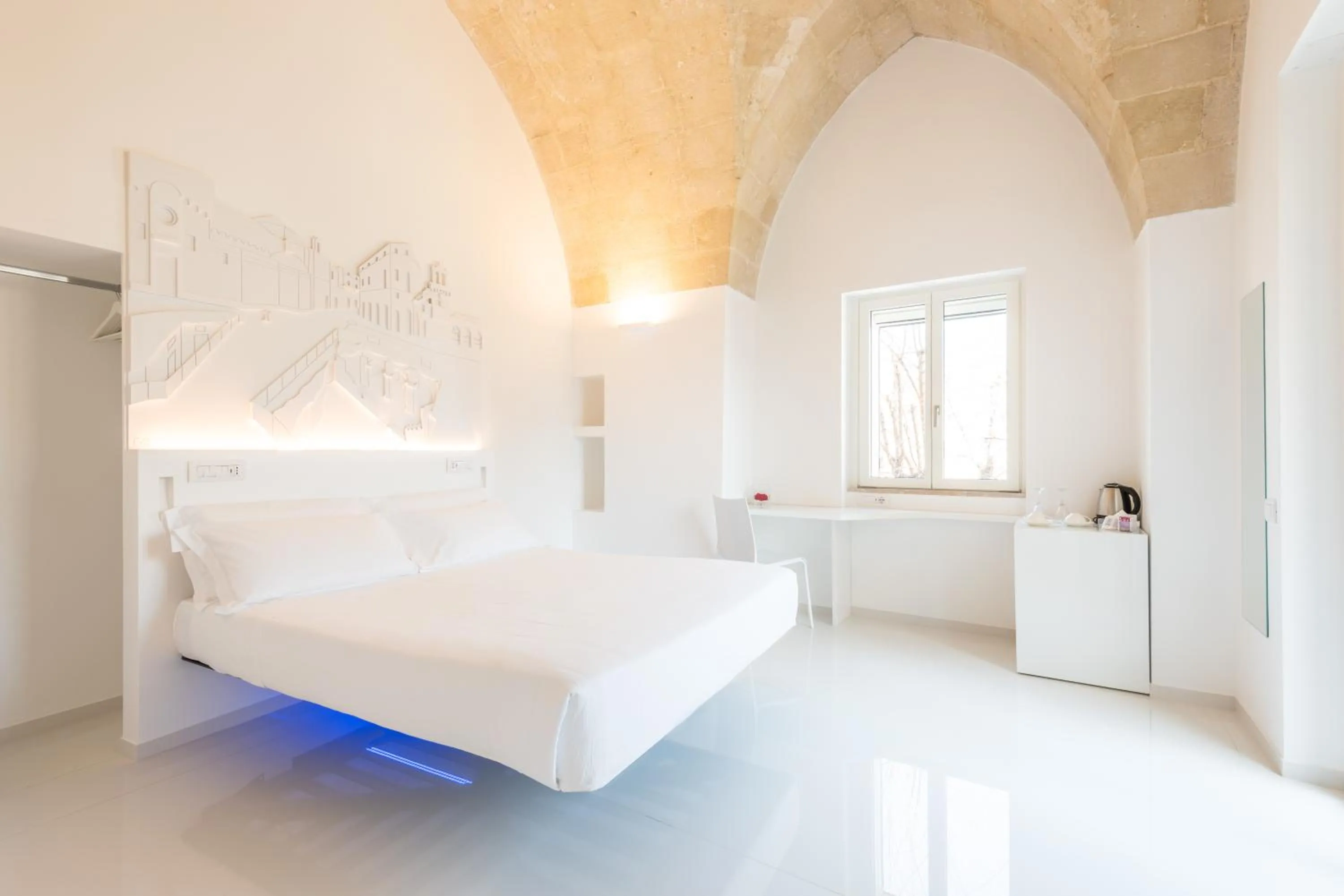 Bed in Vittorio Veneto Matera Luxury Rooms