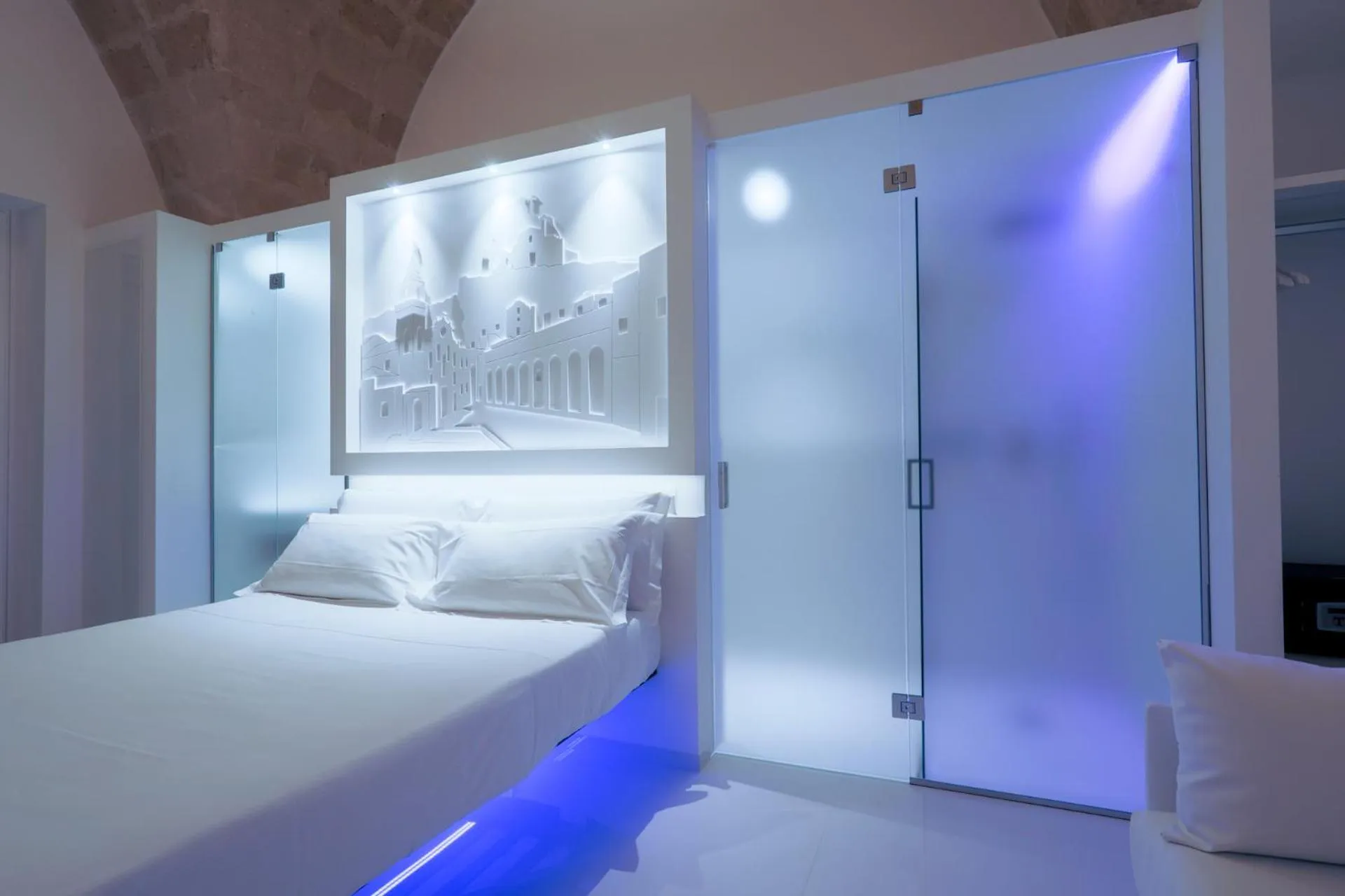 Bed in Vittorio Veneto Matera Luxury Rooms